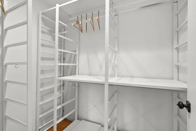 a view of a bedroom with washer and dryer