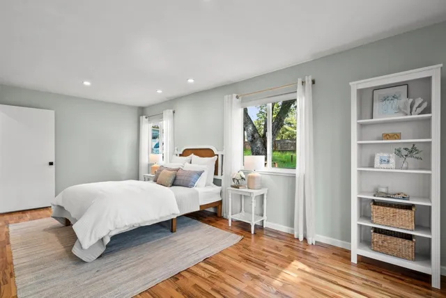 a view of a balcony with wooden floor