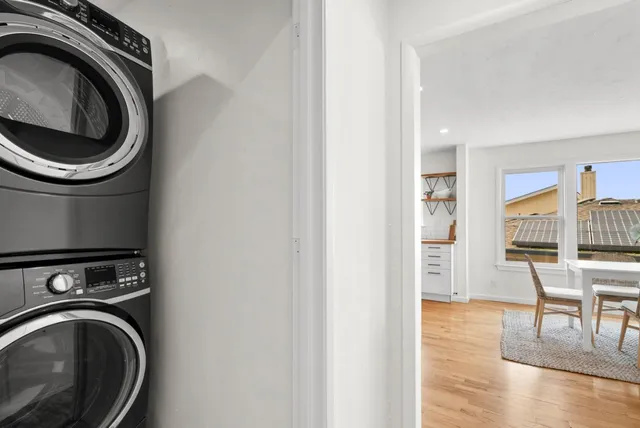 a view of a chair and table on the deck