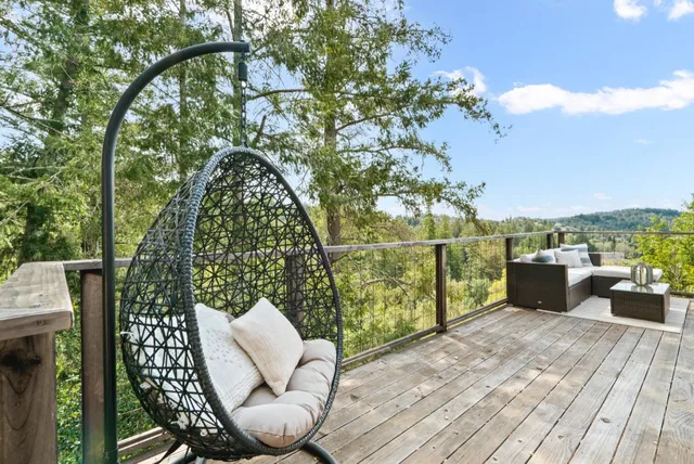a view of a balcony with furniture