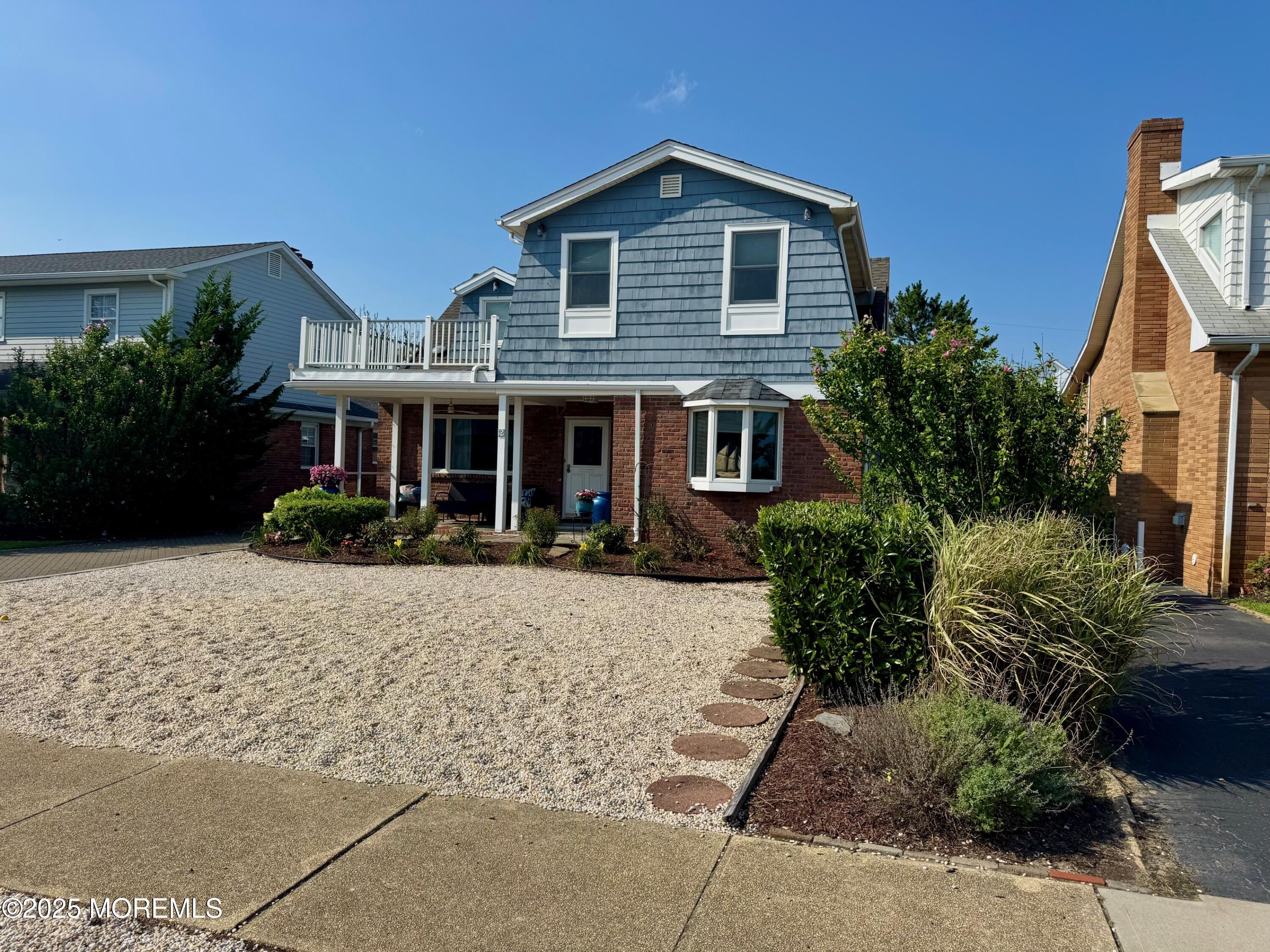 12 York Avenue Spring Lake, NJ 07762 - Photo 2 of 15 a front view of a house with a yard