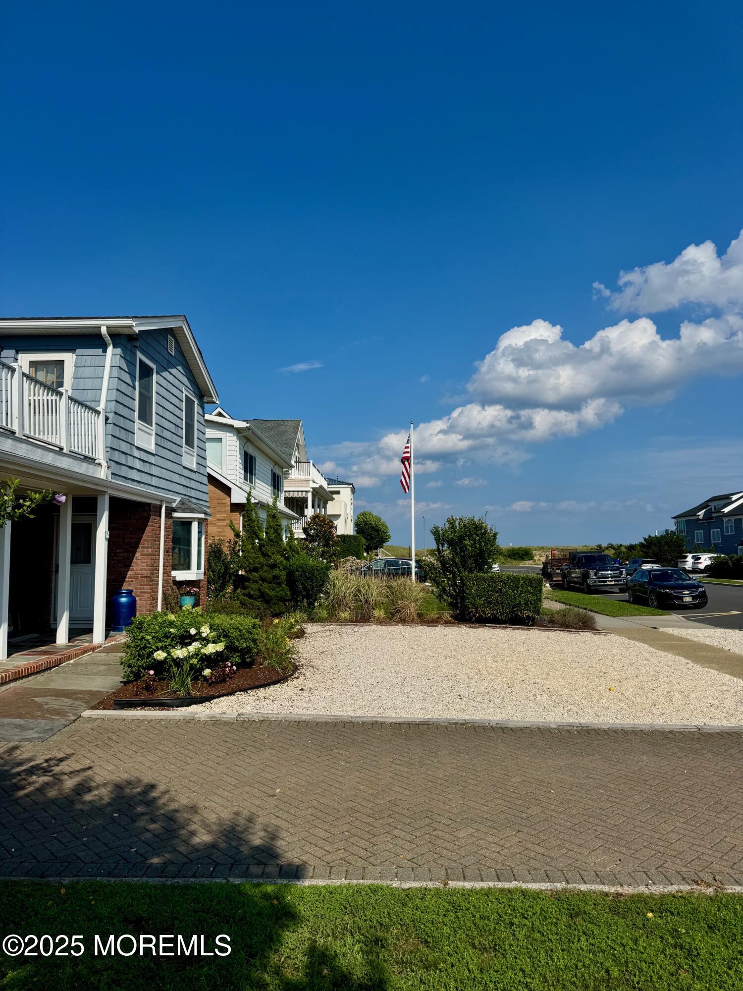 12 York Avenue Spring Lake, NJ 07762 - Photo 3 of 15 a front view of a house with a yard