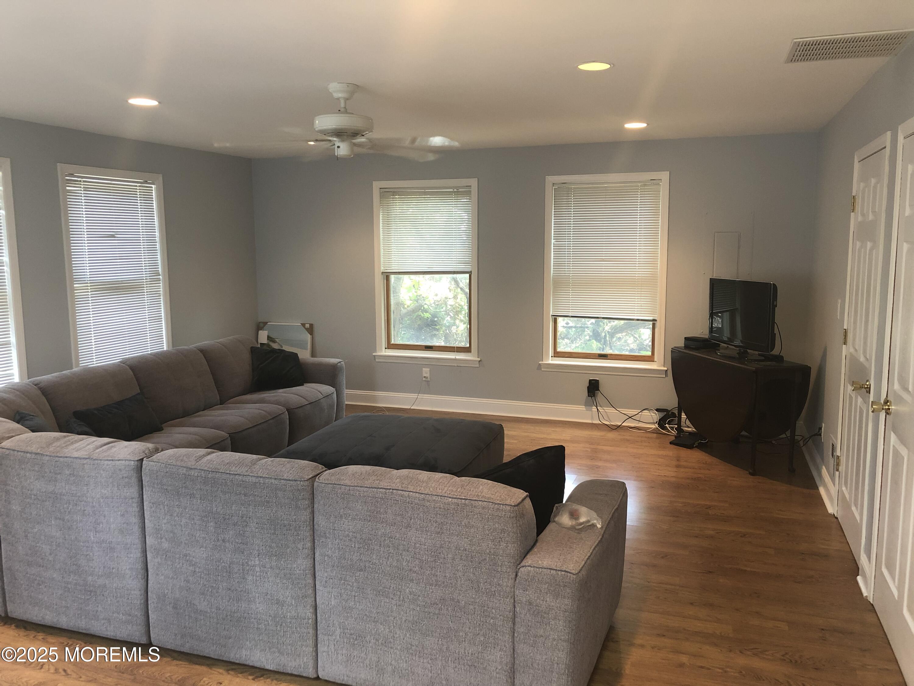 12 York Avenue Spring Lake, NJ 07762 - Photo 7 of 15 a living room with furniture and a flat screen tv