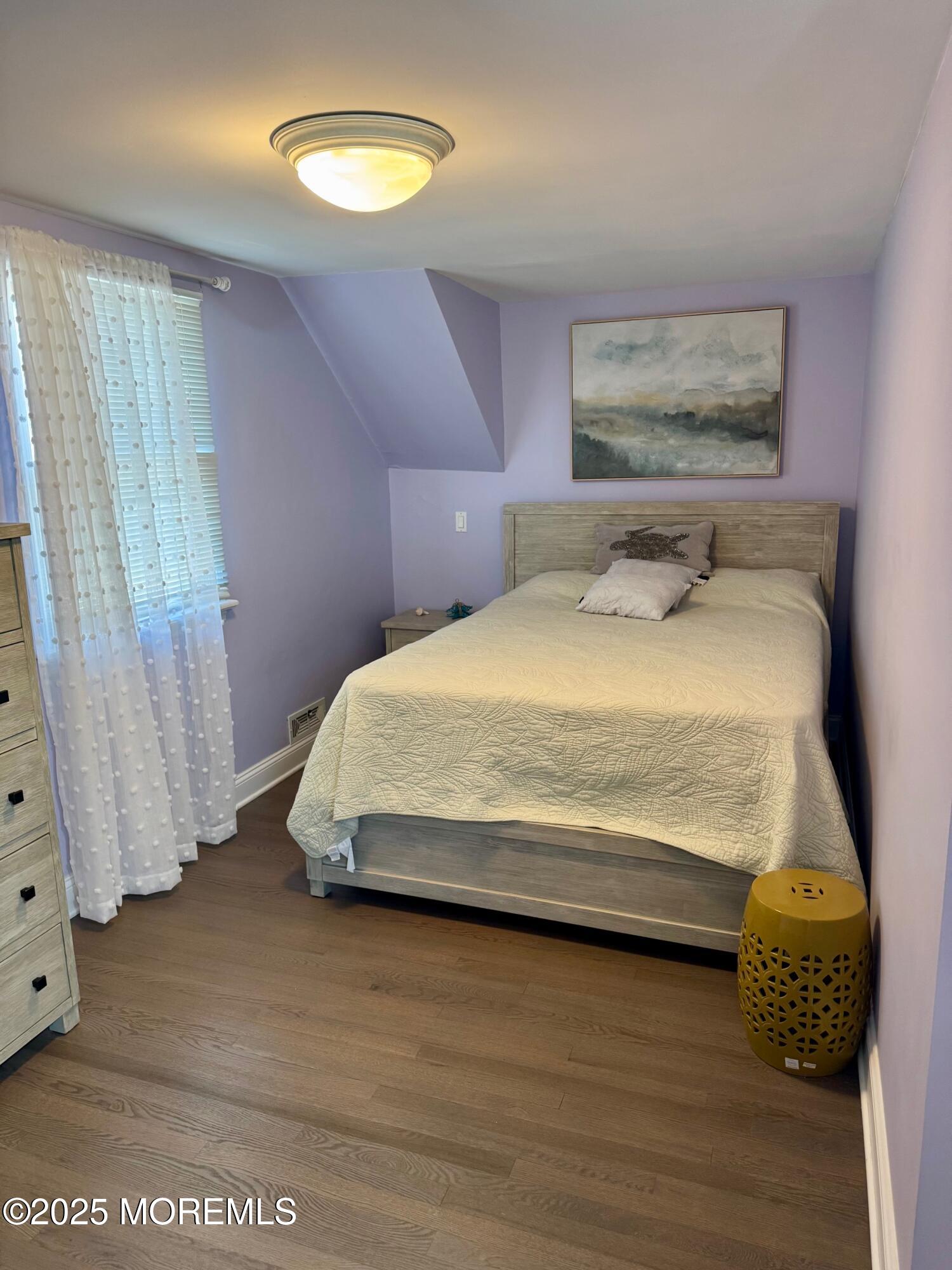 12 York Avenue Spring Lake, NJ 07762 - Photo 9 of 15 a bedroom with a bed and a window