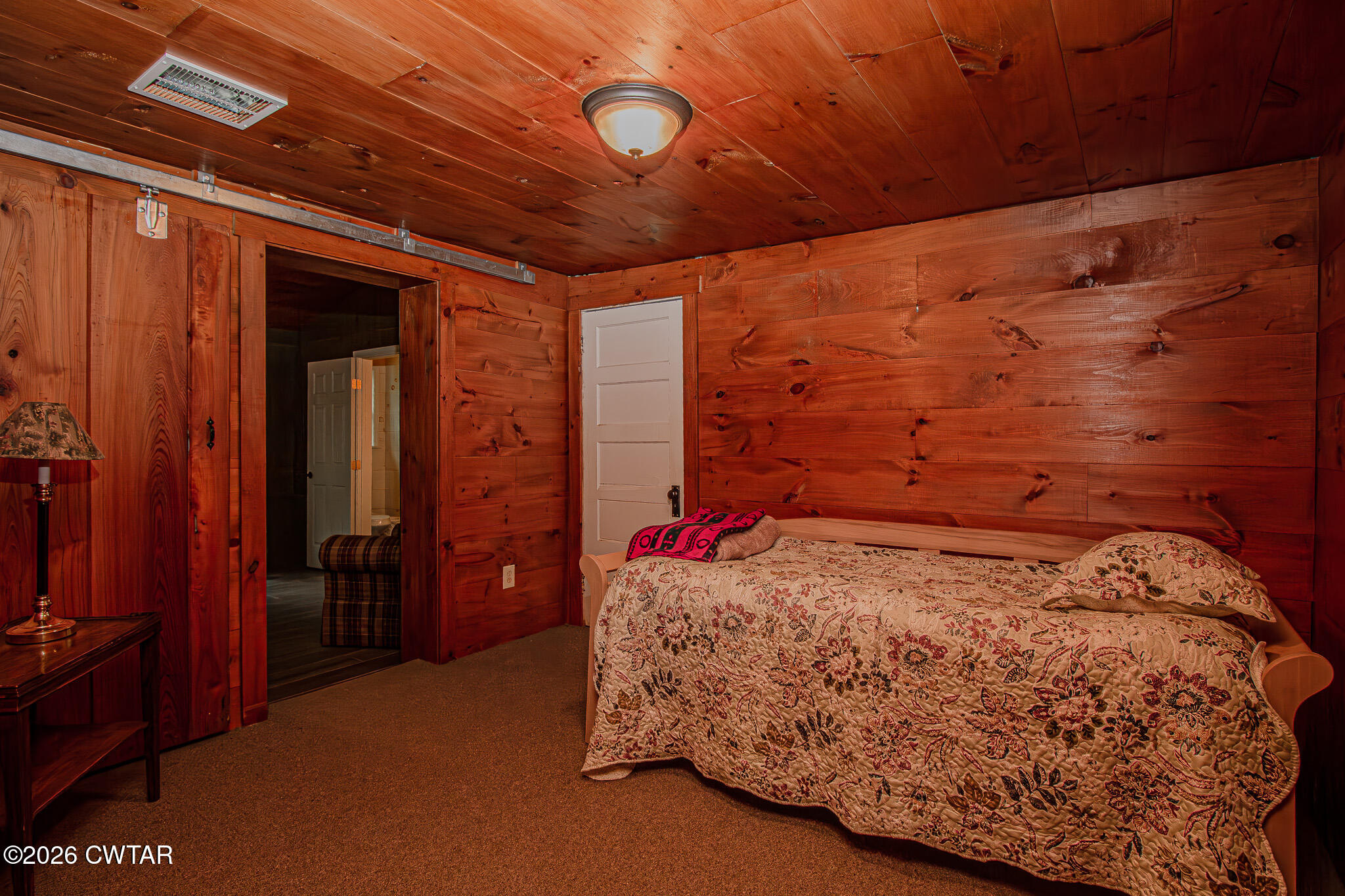 445 Wesley Lake Road Brownsville, TN 38012 - Photo 15 of 21 a bed sitting in a bedroom next to a window