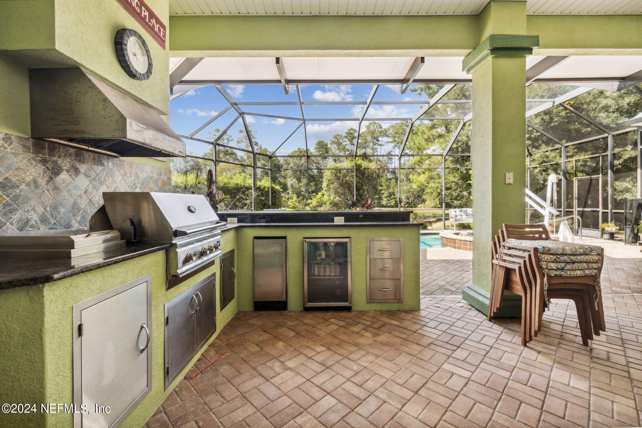 2771 Shade Tree Drive Fleming Island, FL 32003 - Photo 17 of 40 a kitchen with a stove and a table