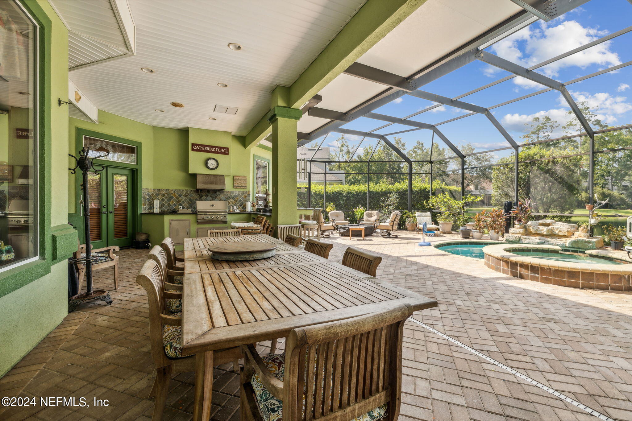 2771 Shade Tree Drive Fleming Island, FL 32003 - Photo 18 of 40 a view of a patio with a dining table and chairs