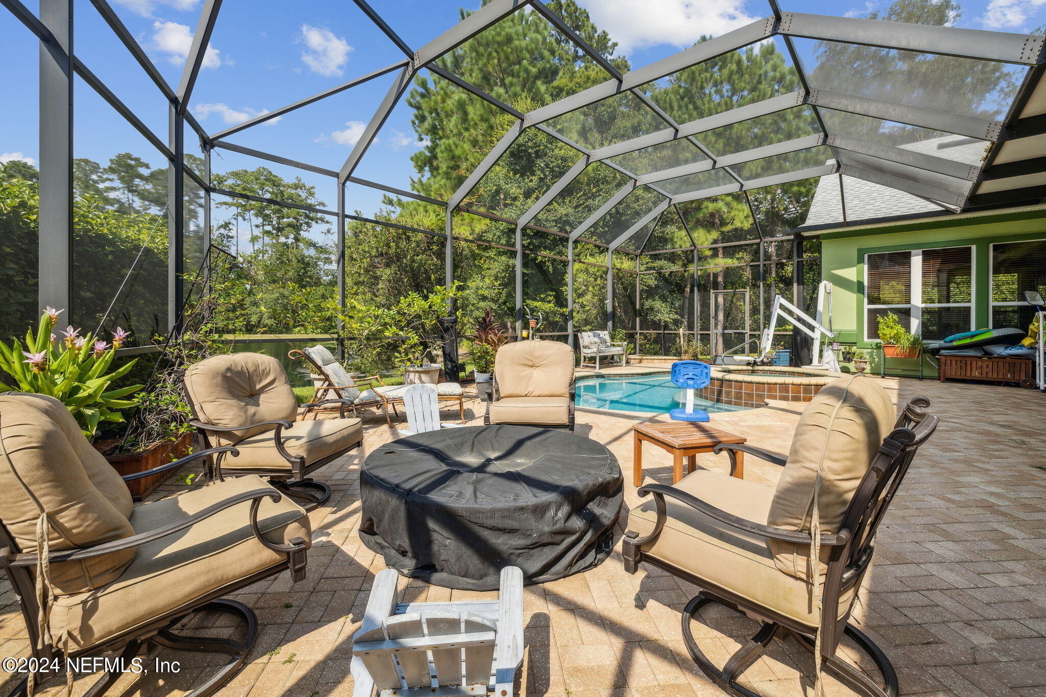 2771 Shade Tree Drive Fleming Island, FL 32003 - Photo 20 of 40 a view of a patio with table and chairs and potted plants
