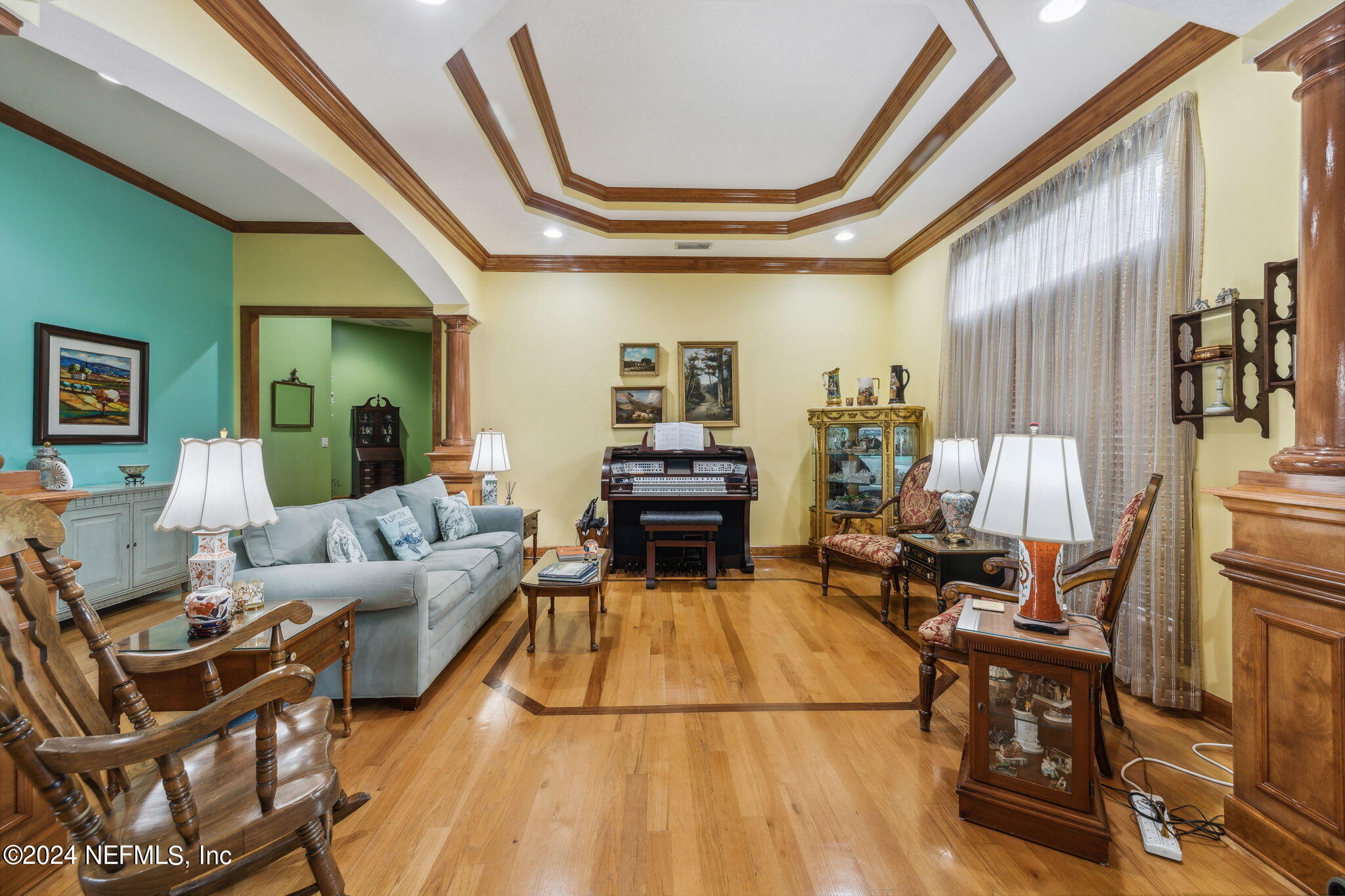 2771 Shade Tree Drive Fleming Island, FL 32003 - Photo 2 of 40 a living room with furniture and a chandelier