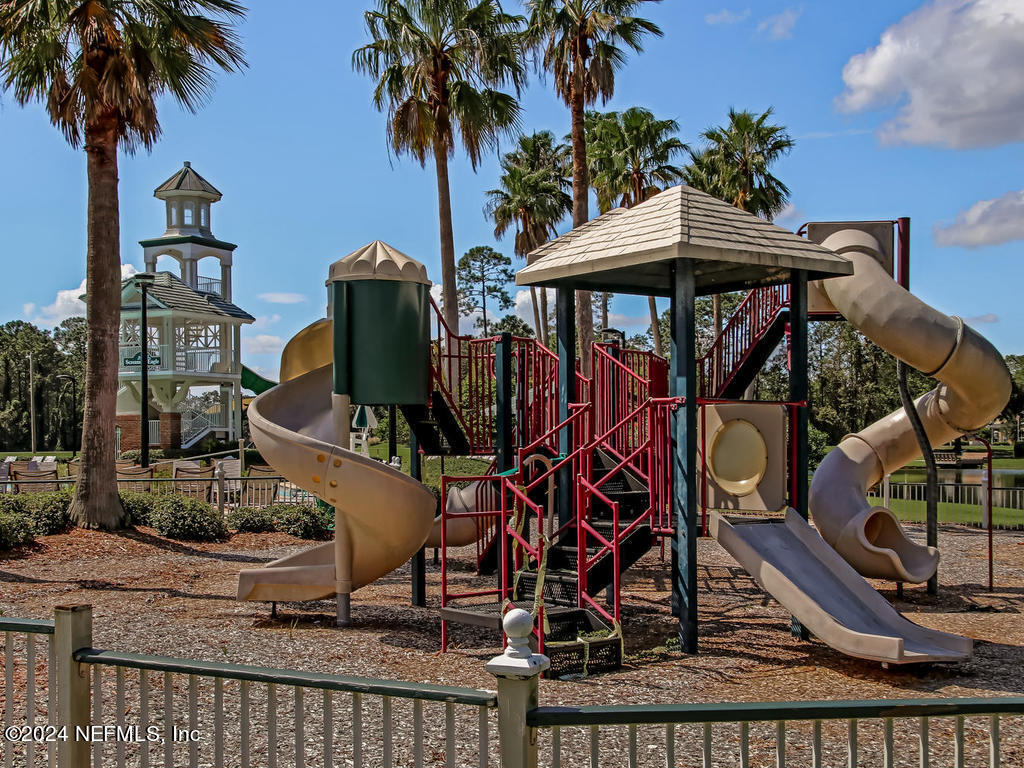 2771 Shade Tree Drive Fleming Island, FL 32003 - Photo 32 of 40 a view of a house with backyard and sitting area