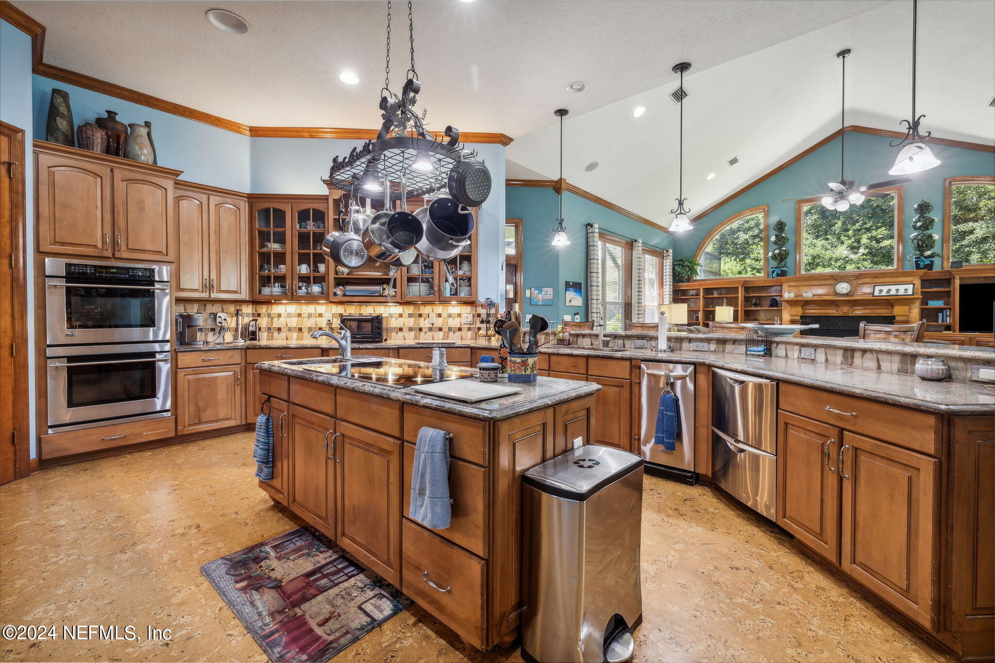 2771 Shade Tree Drive Fleming Island, FL 32003 - Photo 7 of 40 a kitchen with stainless steel appliances granite countertop a stove a sink and a refrigerator
