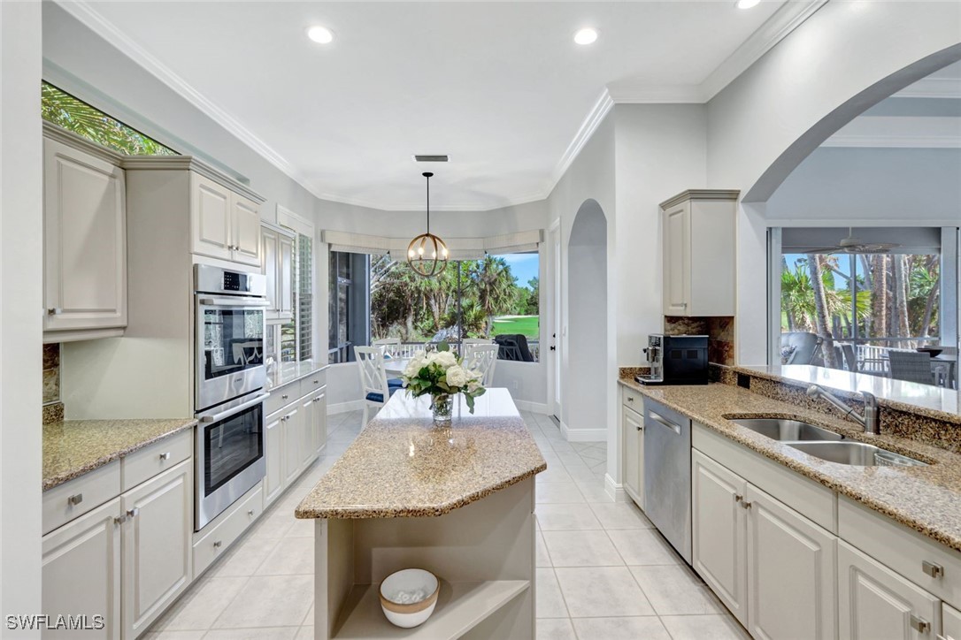 2450 Wulfert Road Sanibel, FL 33957 - Photo 18 of 44 a kitchen with a sink stove and cabinets