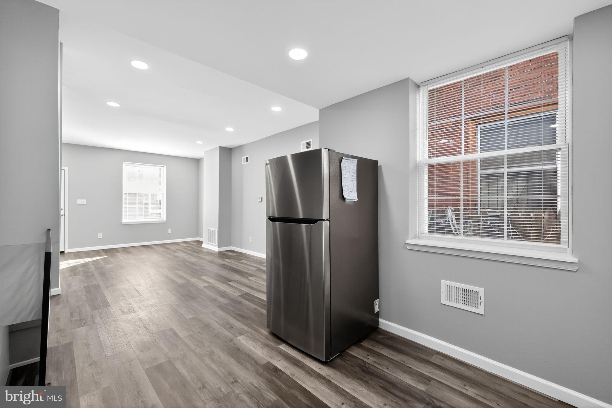 4516 North Mole Street Philadelphia, PA 19140 - Photo 13 of 30 an empty room with wooden floor and a window