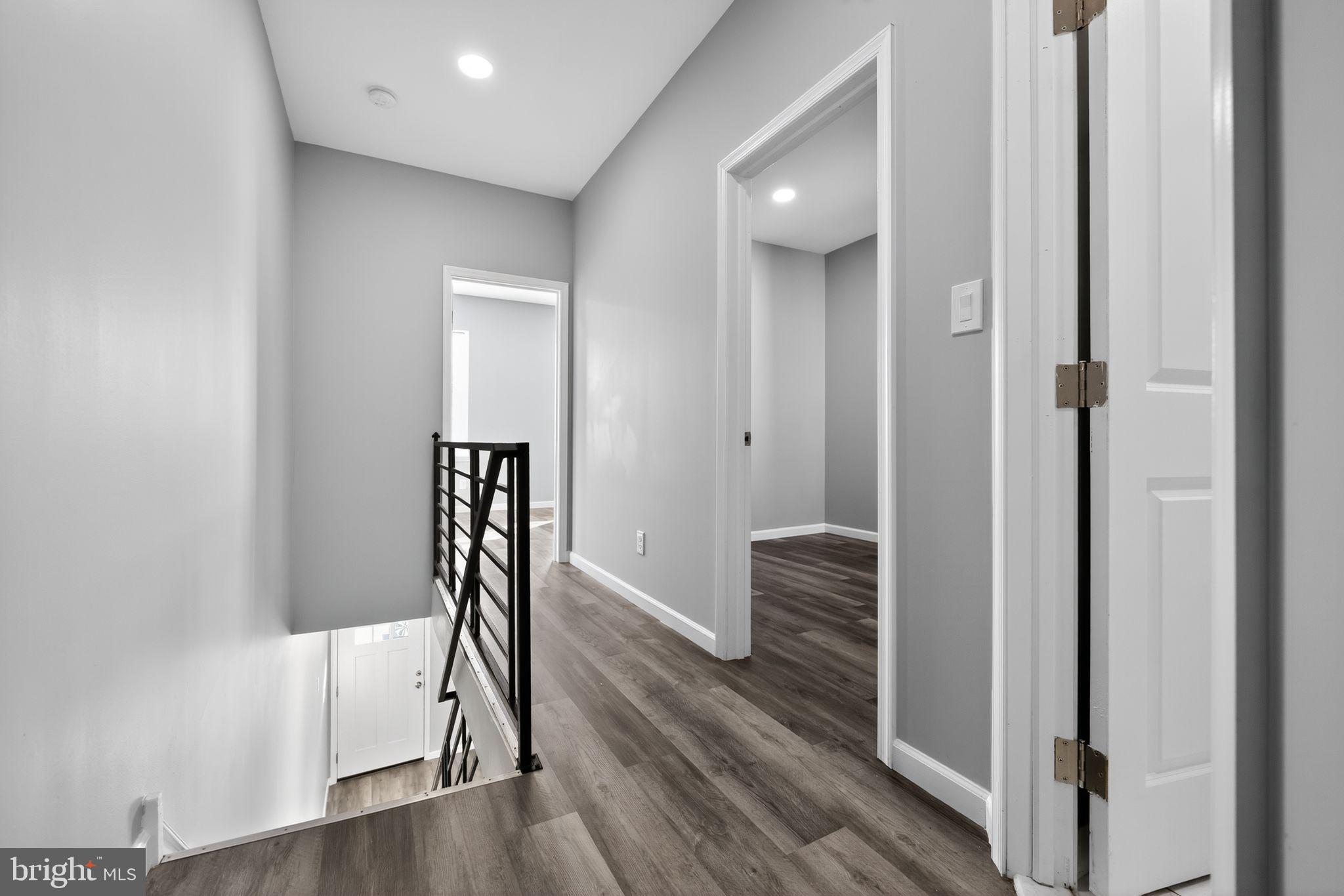 4516 North Mole Street Philadelphia, PA 19140 - Photo 14 of 30 a view of a hallway with wooden floor and stairs
