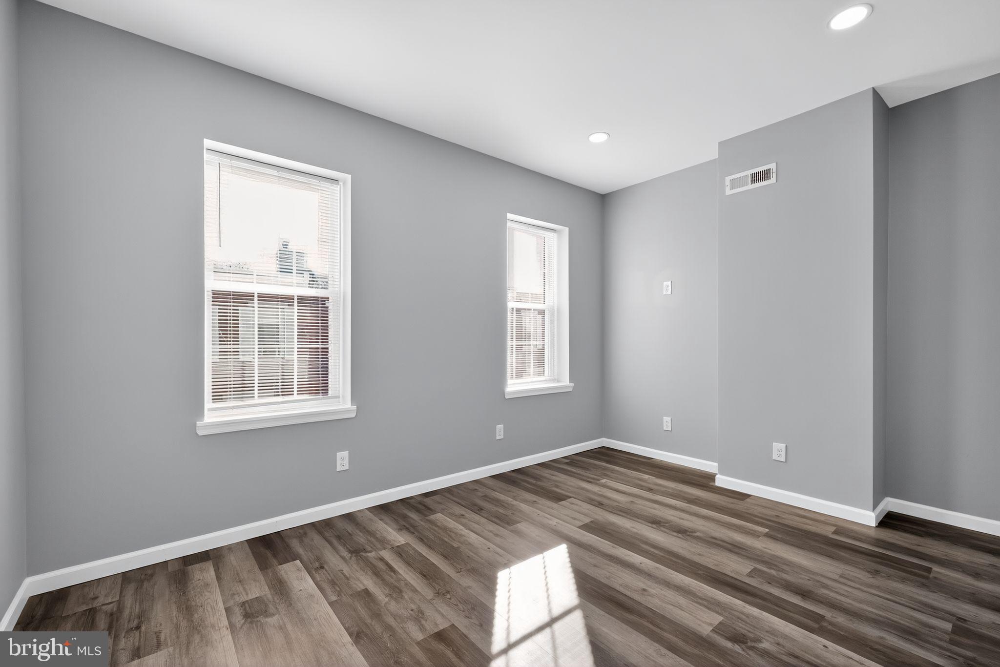 4516 North Mole Street Philadelphia, PA 19140 - Photo 17 of 30 a view of empty room with wooden floor and fan