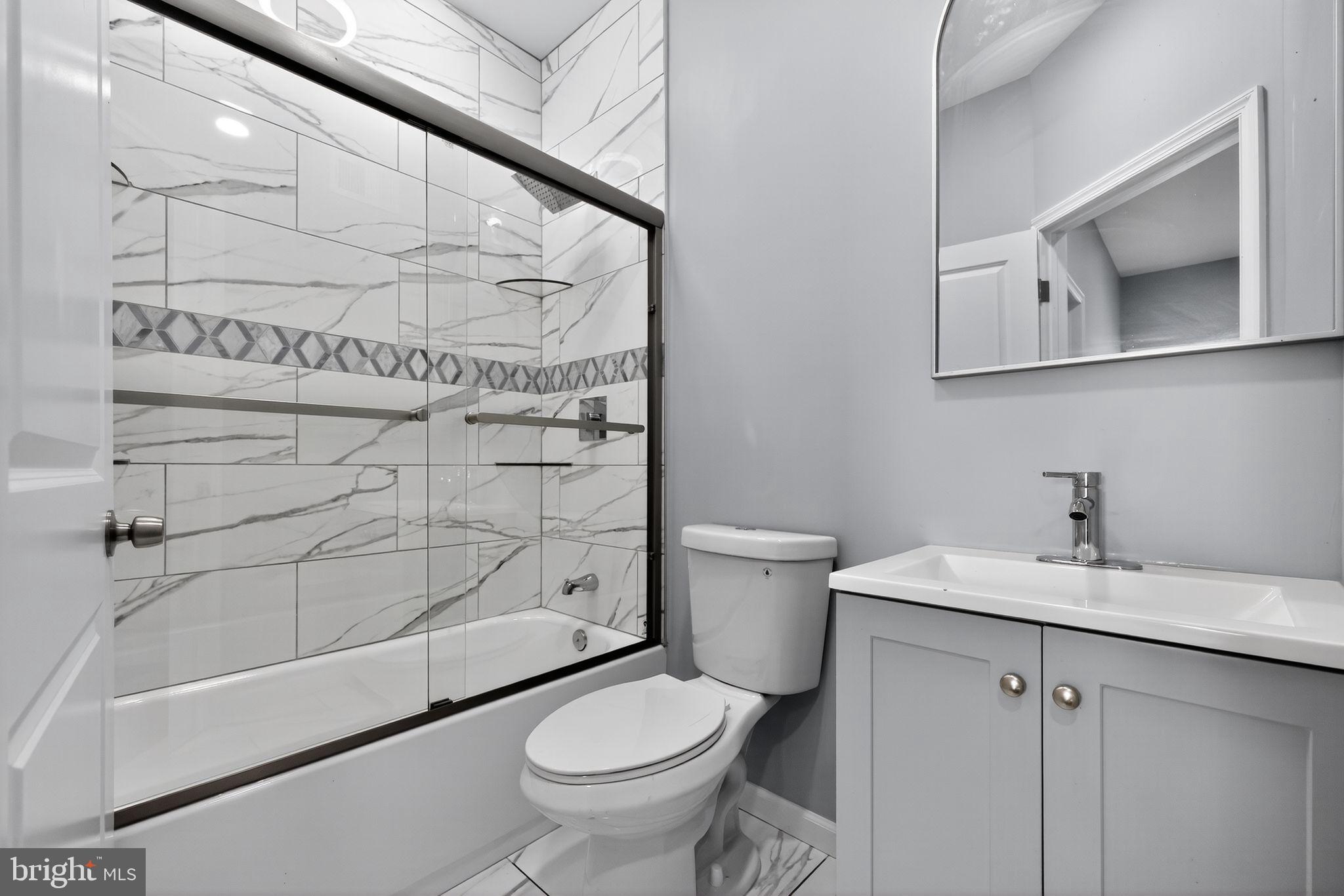 4516 North Mole Street Philadelphia, PA 19140 - Photo 22 of 30 a bathroom with a sink toilet and shower