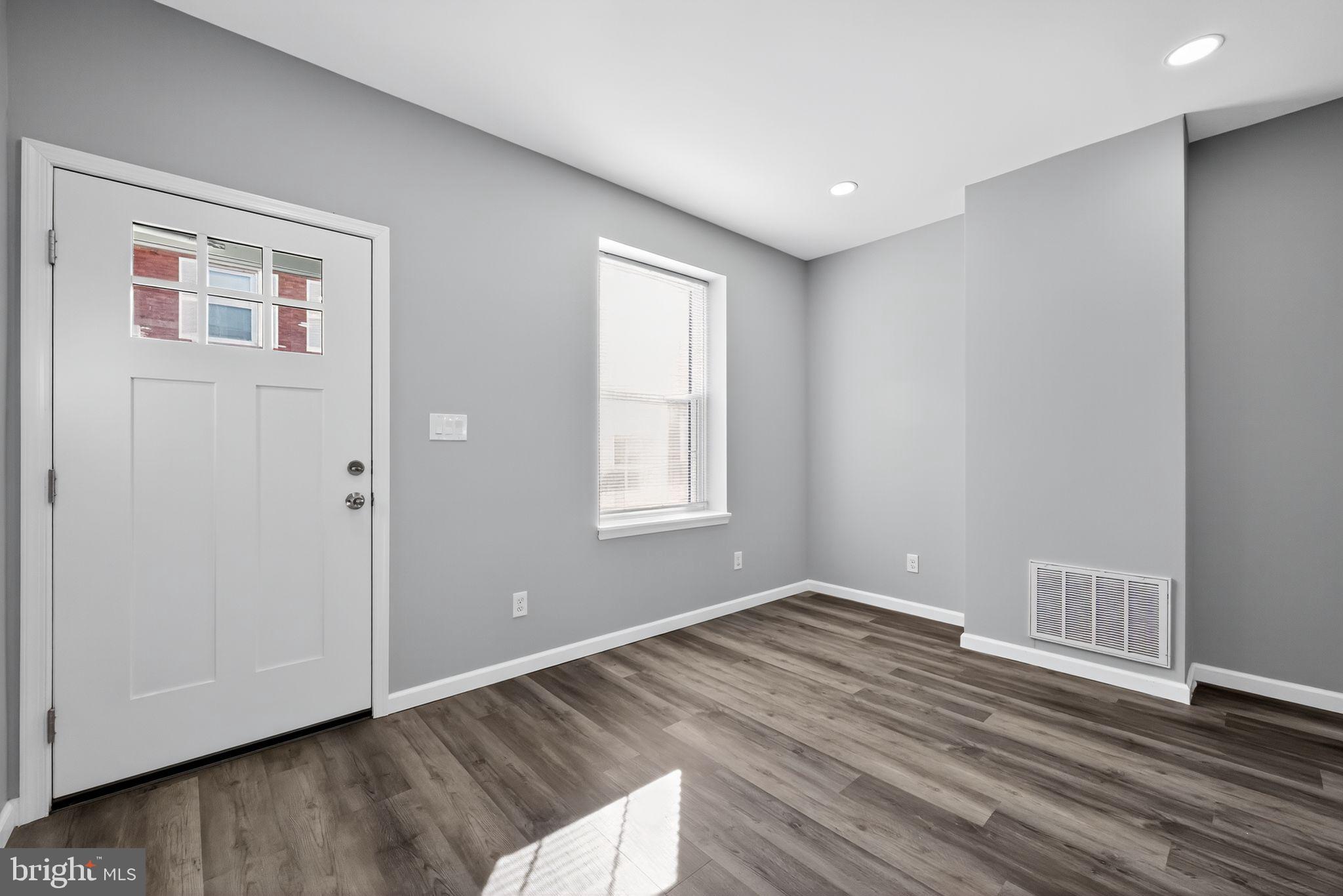 4516 North Mole Street Philadelphia, PA 19140 - Photo 5 of 30 a view of an empty room with wooden floor and a window