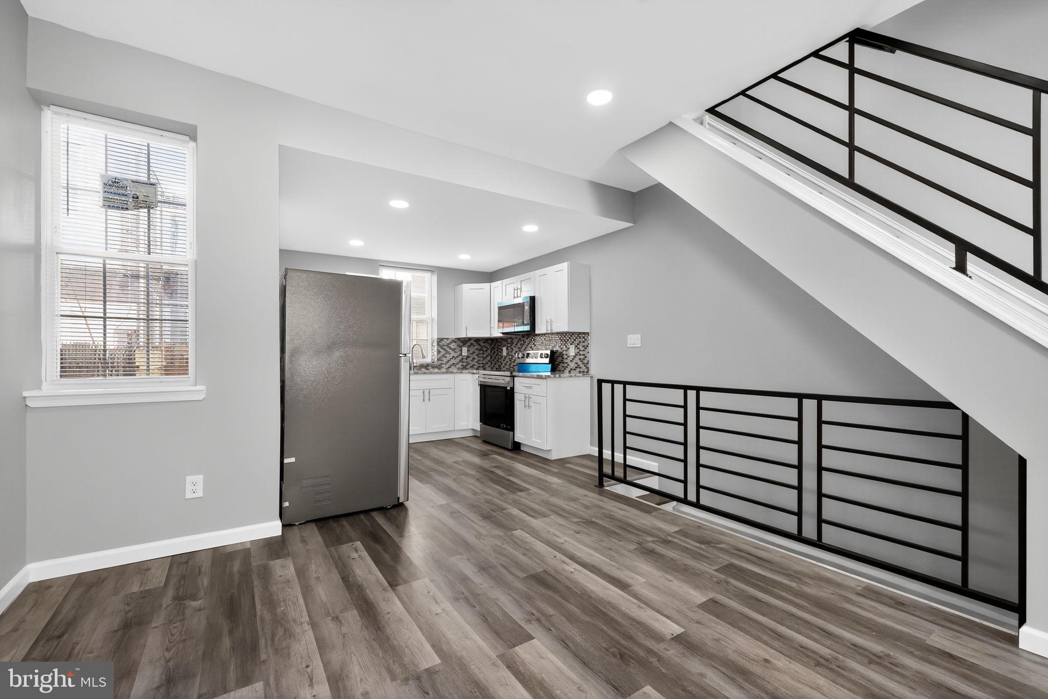 4516 North Mole Street Philadelphia, PA 19140 - Photo 8 of 30 a view of kitchen with furniture and wooden floor