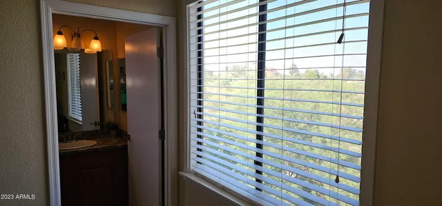 a bathroom with a shower and a sink