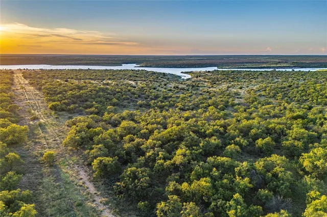 an aerial view of residential building and ocean