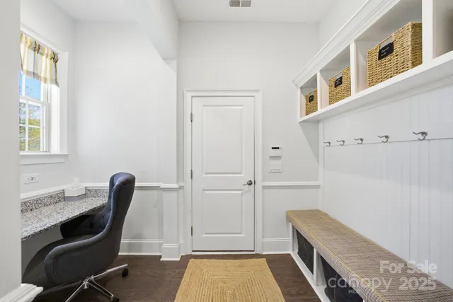 a living room with furniture rug and window