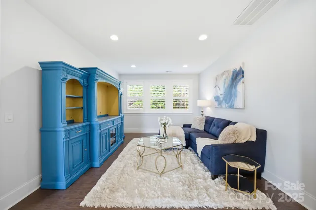 a bathroom with a tub sink shower and mirror