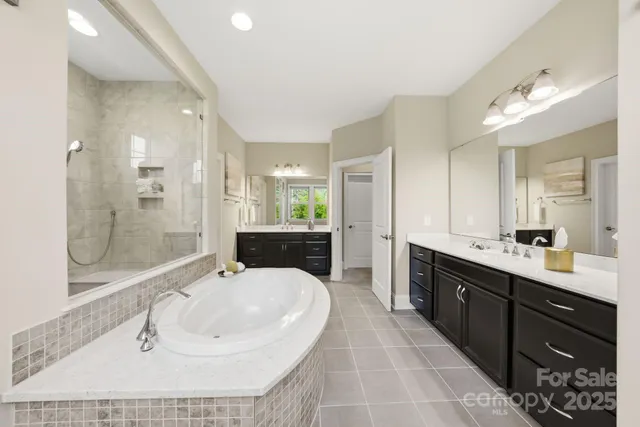 a bedroom with a bed and a ceiling fan