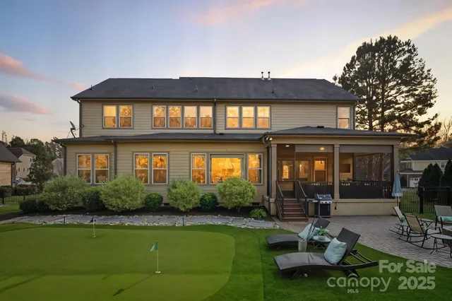 a view of a chairs in a backyard