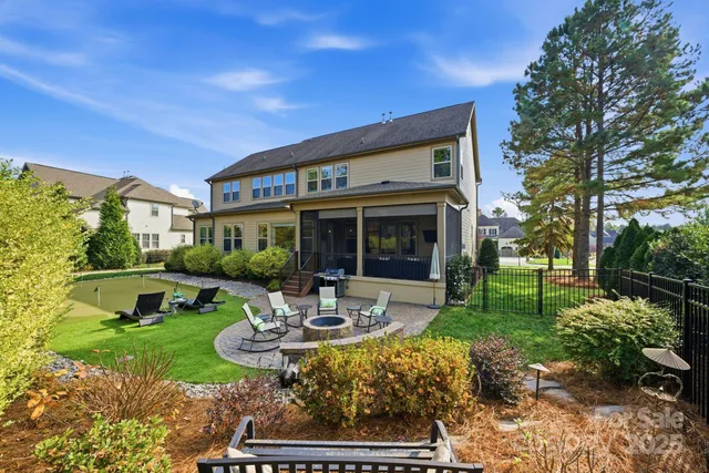a view of a swimming pool in front of a house