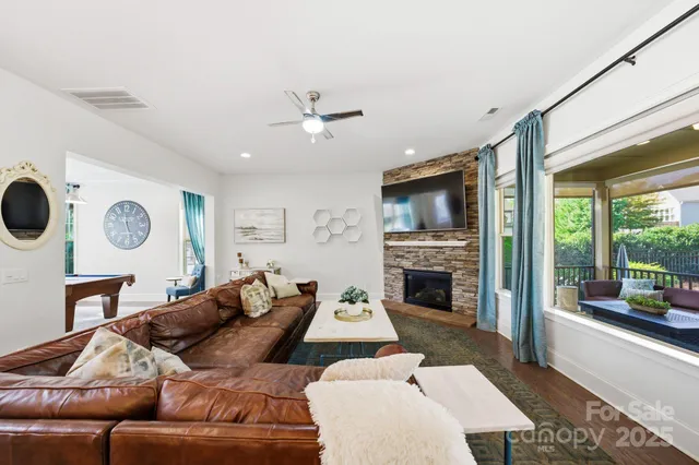 a large kitchen with a table and chairs