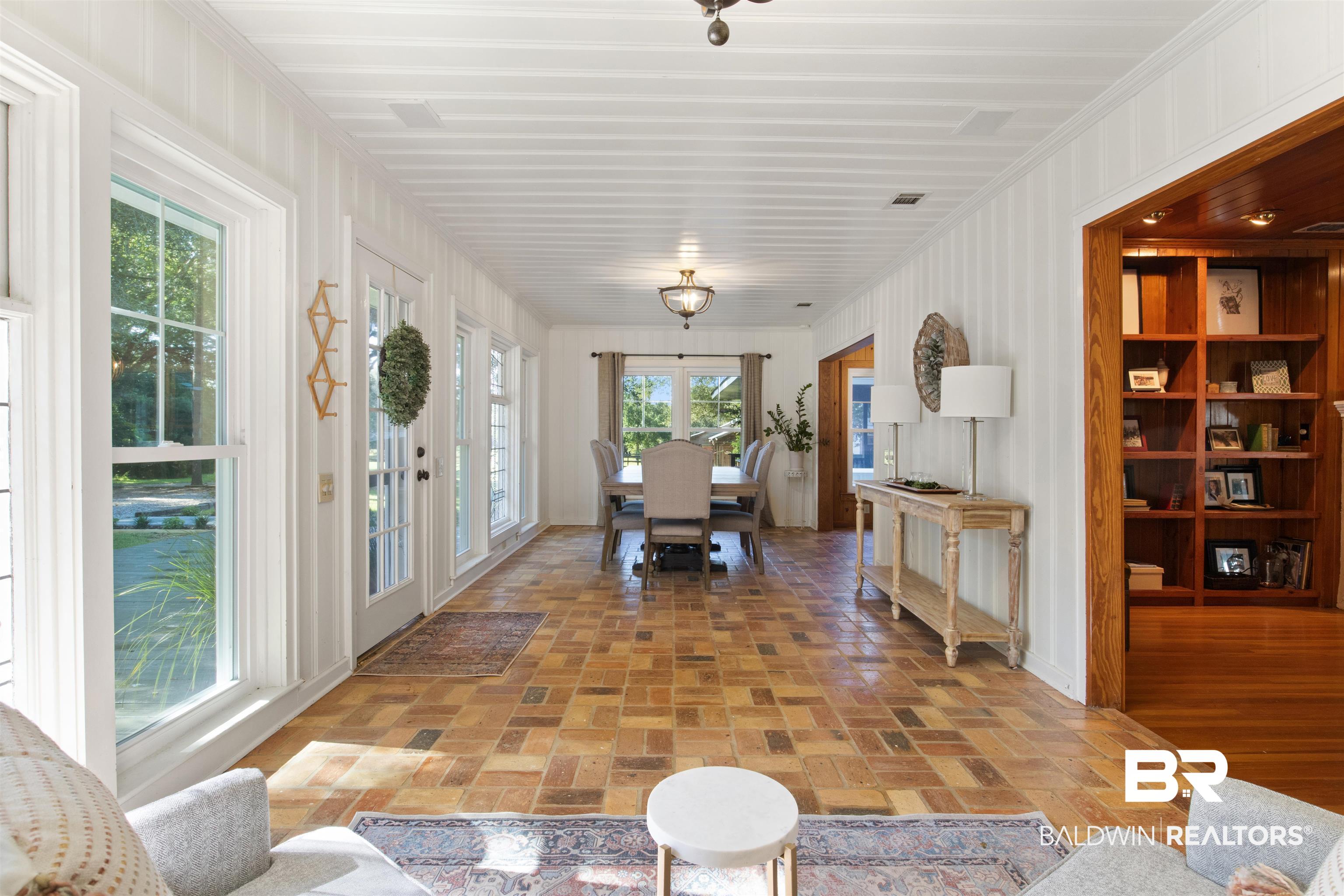 15100 Vasko Road Silverhill, AL 36576 - Photo 17 of 51 Sun filled room looking out past dining area to pond and pastures.