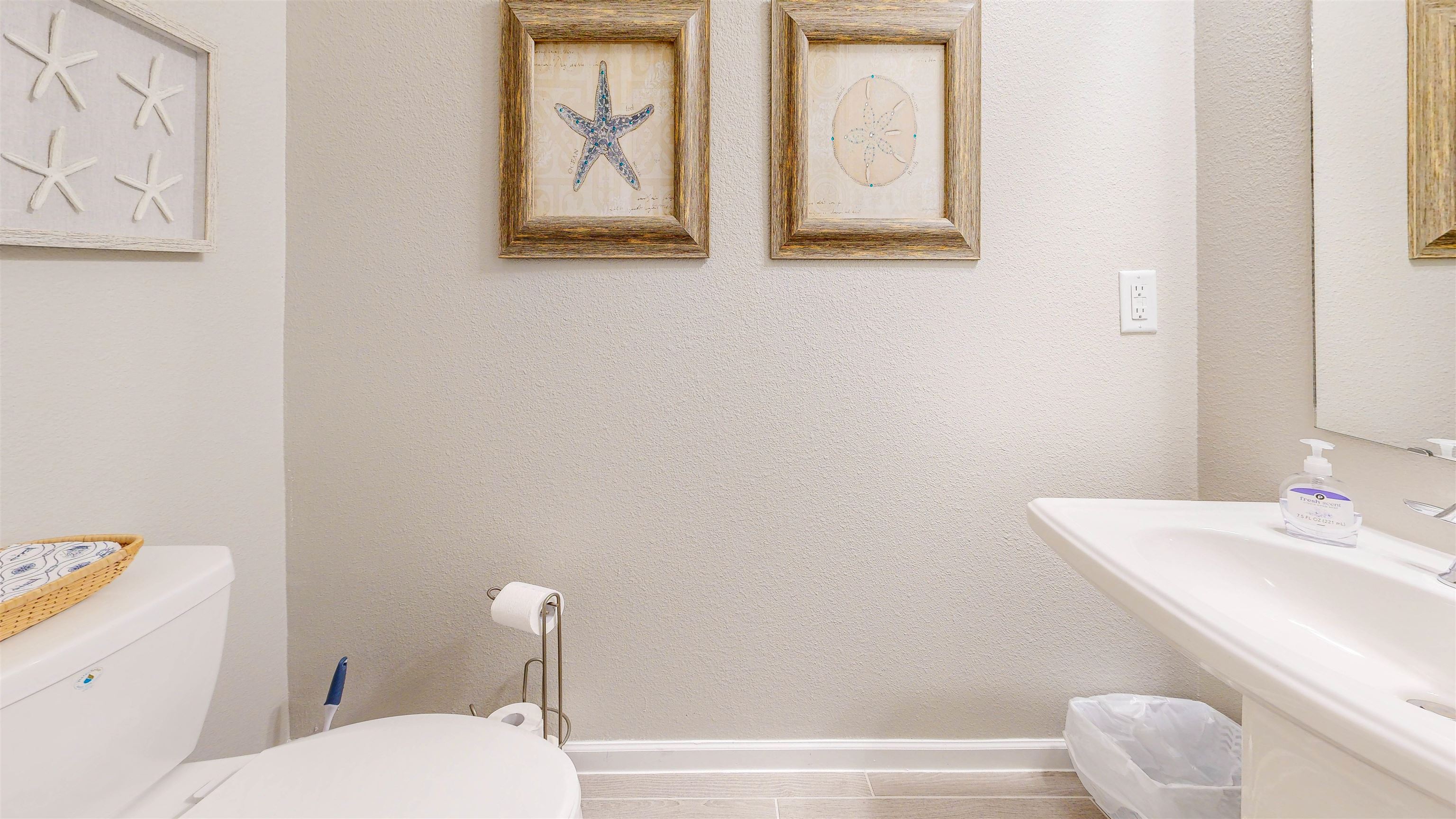 96 Bramble Court St. Augustine, FL 32092 - Photo 12 of 61 a bathroom with a toilet sink and mirror