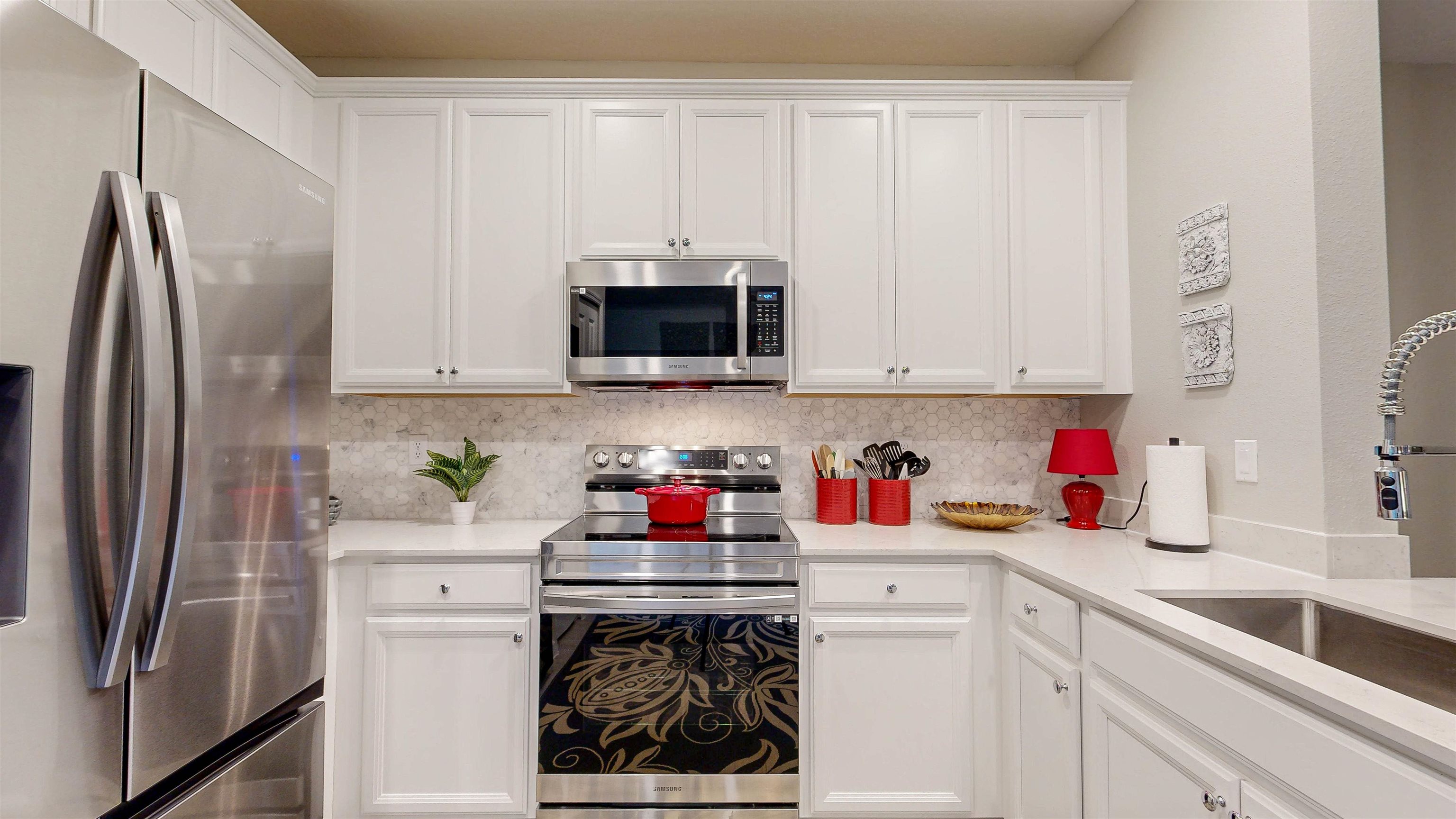 96 Bramble Court St. Augustine, FL 32092 - Photo 16 of 61 a kitchen with stainless steel appliances white cabinets sink and a granite counter tops