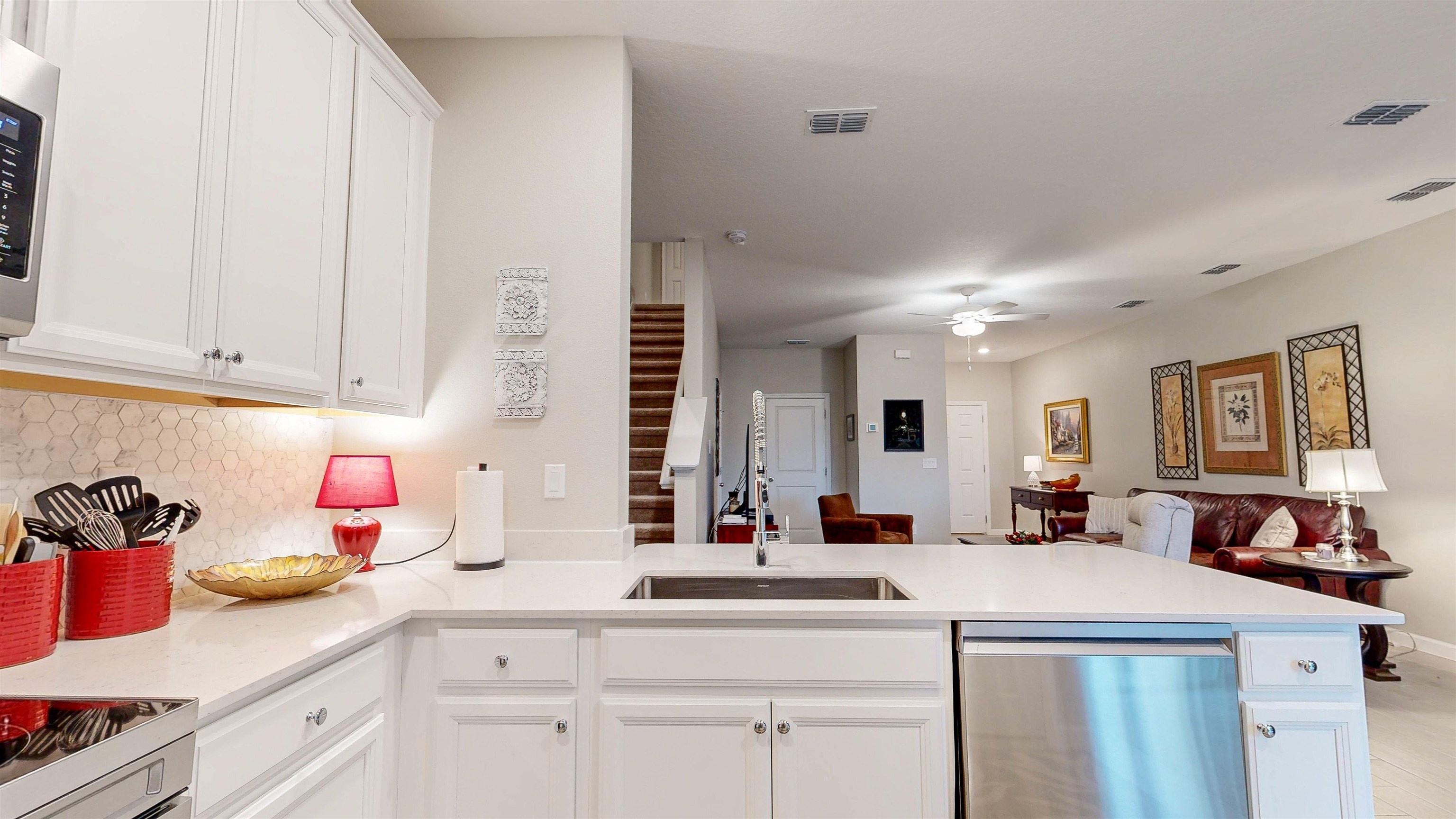 96 Bramble Court St. Augustine, FL 32092 - Photo 17 of 61 a kitchen with a sink and cabinets