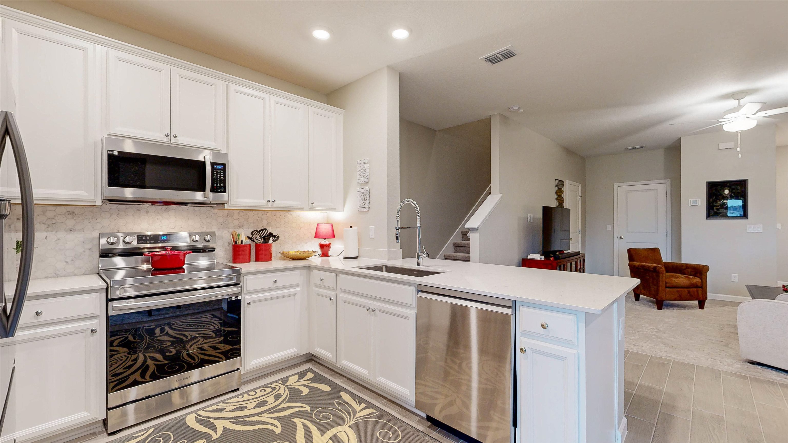 96 Bramble Court St. Augustine, FL 32092 - Photo 18 of 61 a kitchen that has a sink and a stove top oven