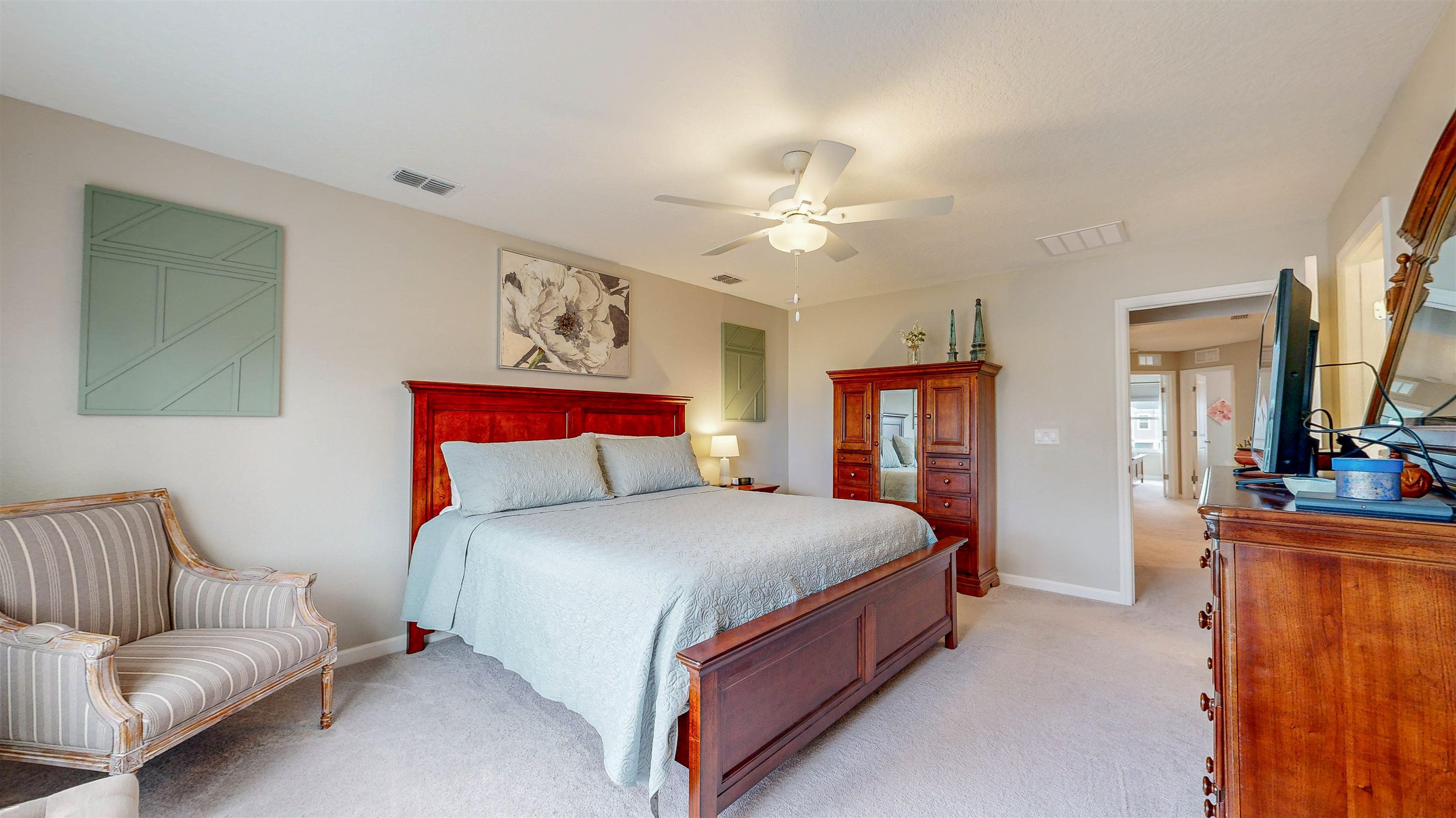 96 Bramble Court St. Augustine, FL 32092 - Photo 22 of 61 a bedroom with a bed a couch and dresser