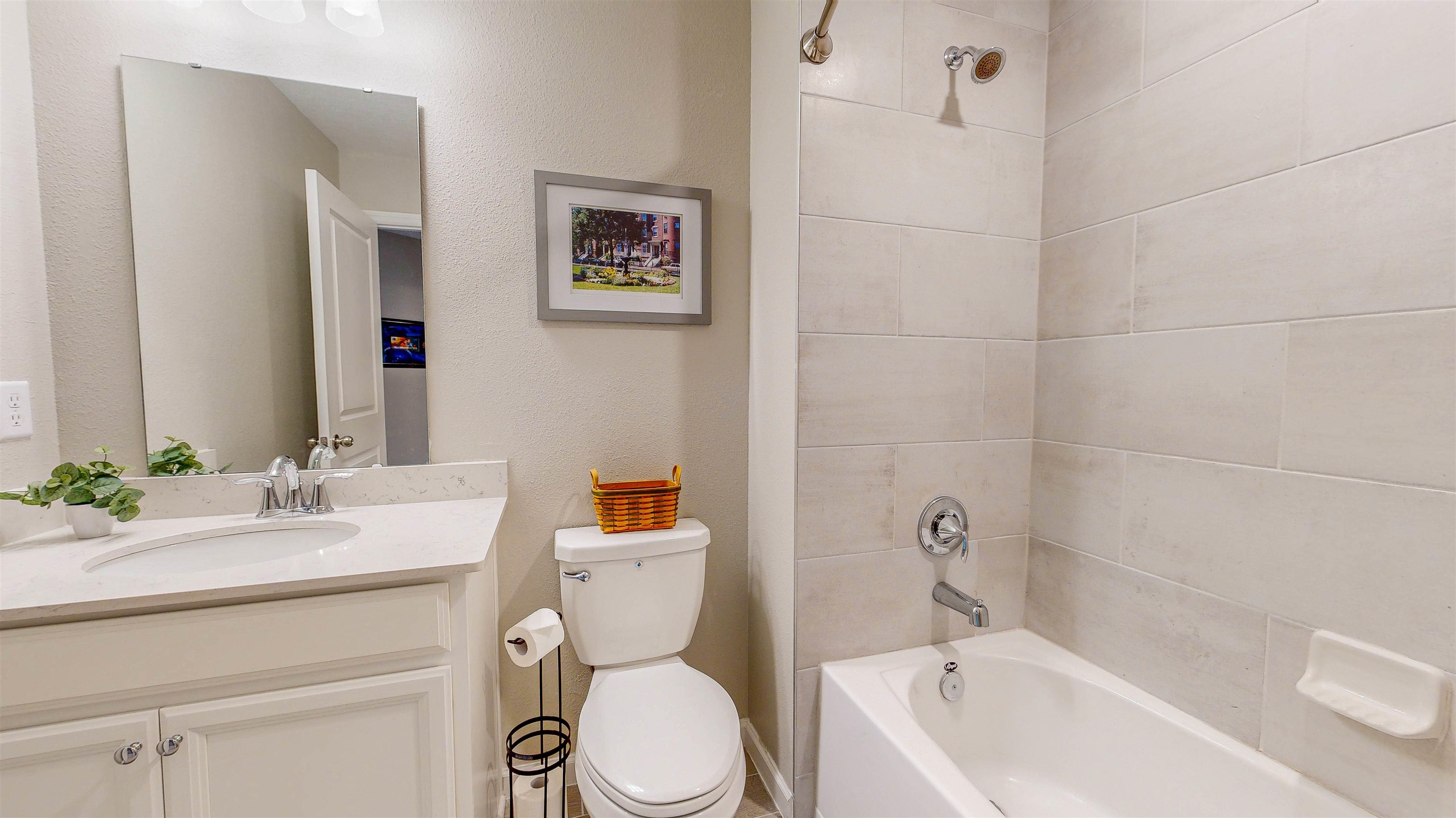 96 Bramble Court St. Augustine, FL 32092 - Photo 29 of 61 a bathroom with a sink a toilet and shower