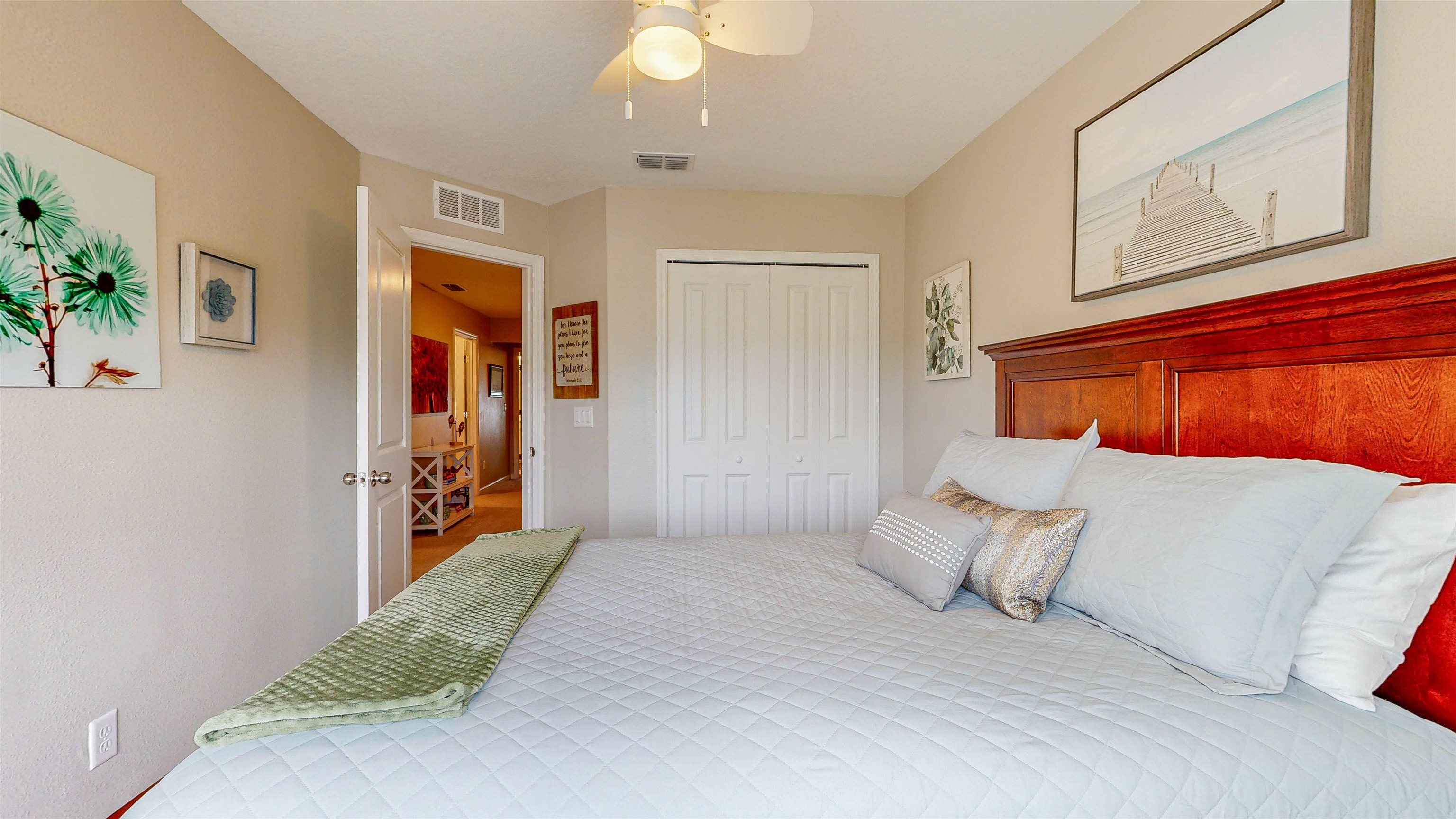 96 Bramble Court St. Augustine, FL 32092 - Photo 35 of 61 a bedroom with a bed and a painting on the wall