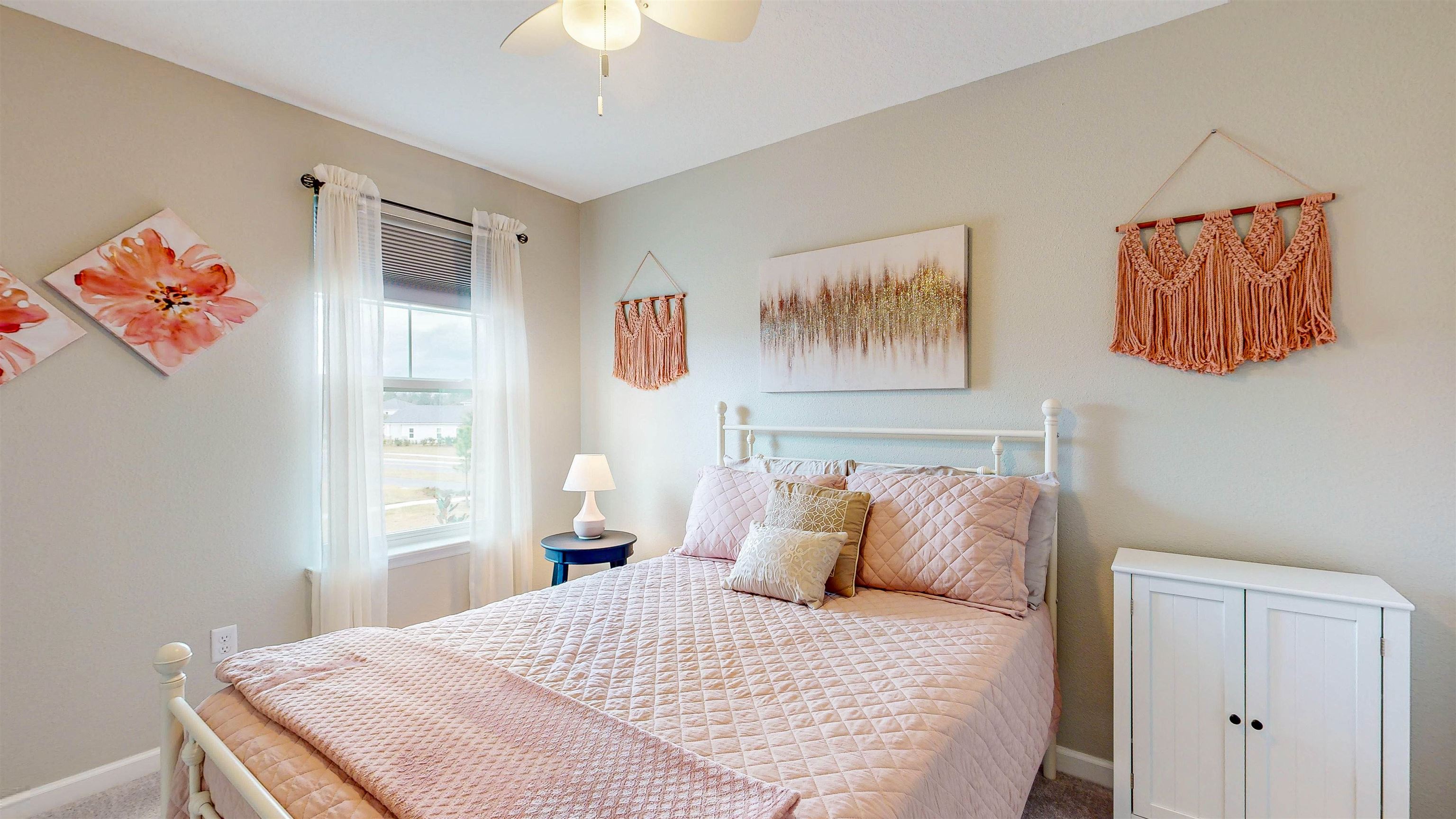 96 Bramble Court St. Augustine, FL 32092 - Photo 36 of 61 a bedroom with a bed and a chandelier