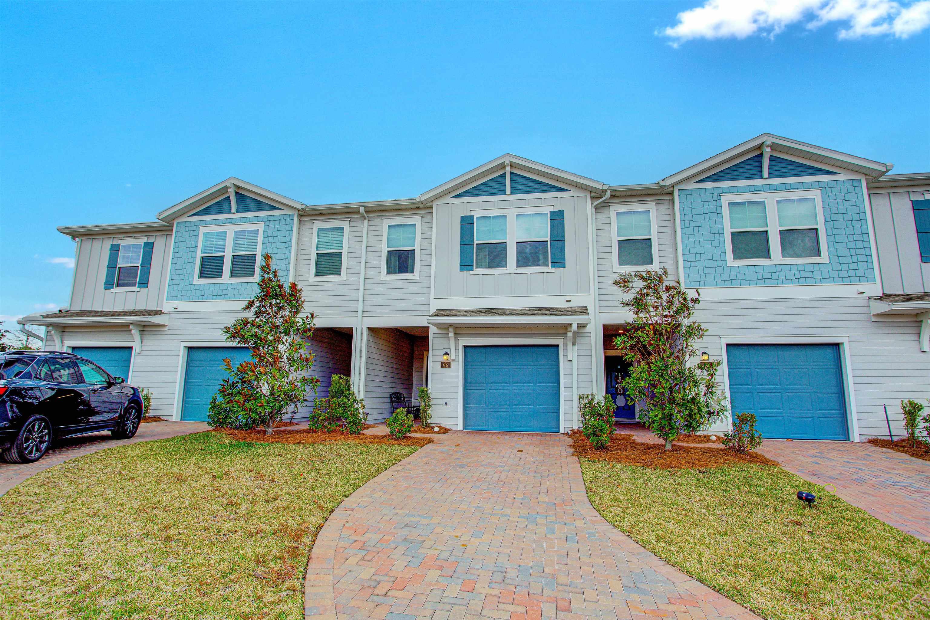 96 Bramble Court St. Augustine, FL 32092 - Photo 46 of 61 a front view of a house with a yard and garage