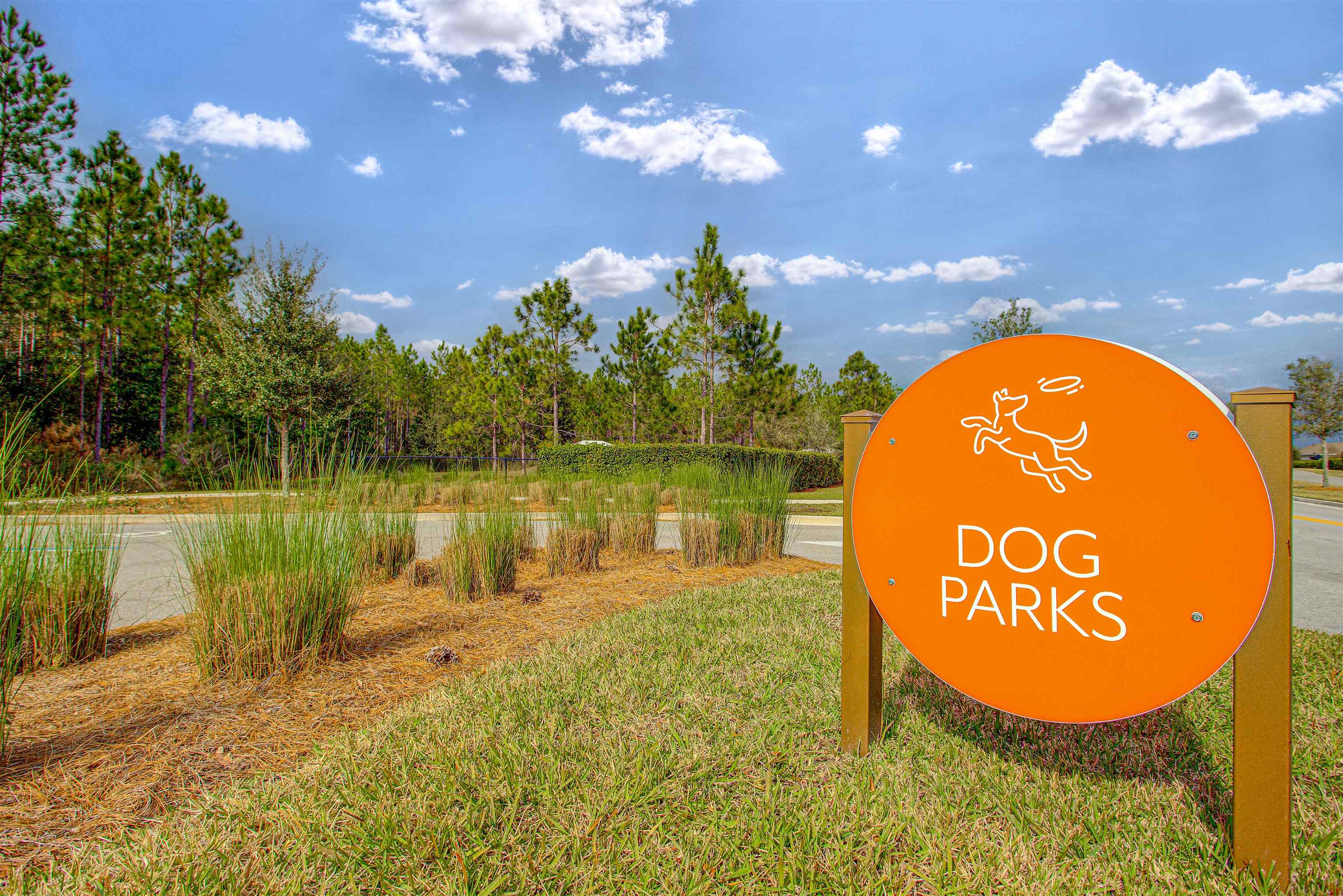 96 Bramble Court St. Augustine, FL 32092 - Photo 57 of 61 a sign that is on a brick wall with a lake view