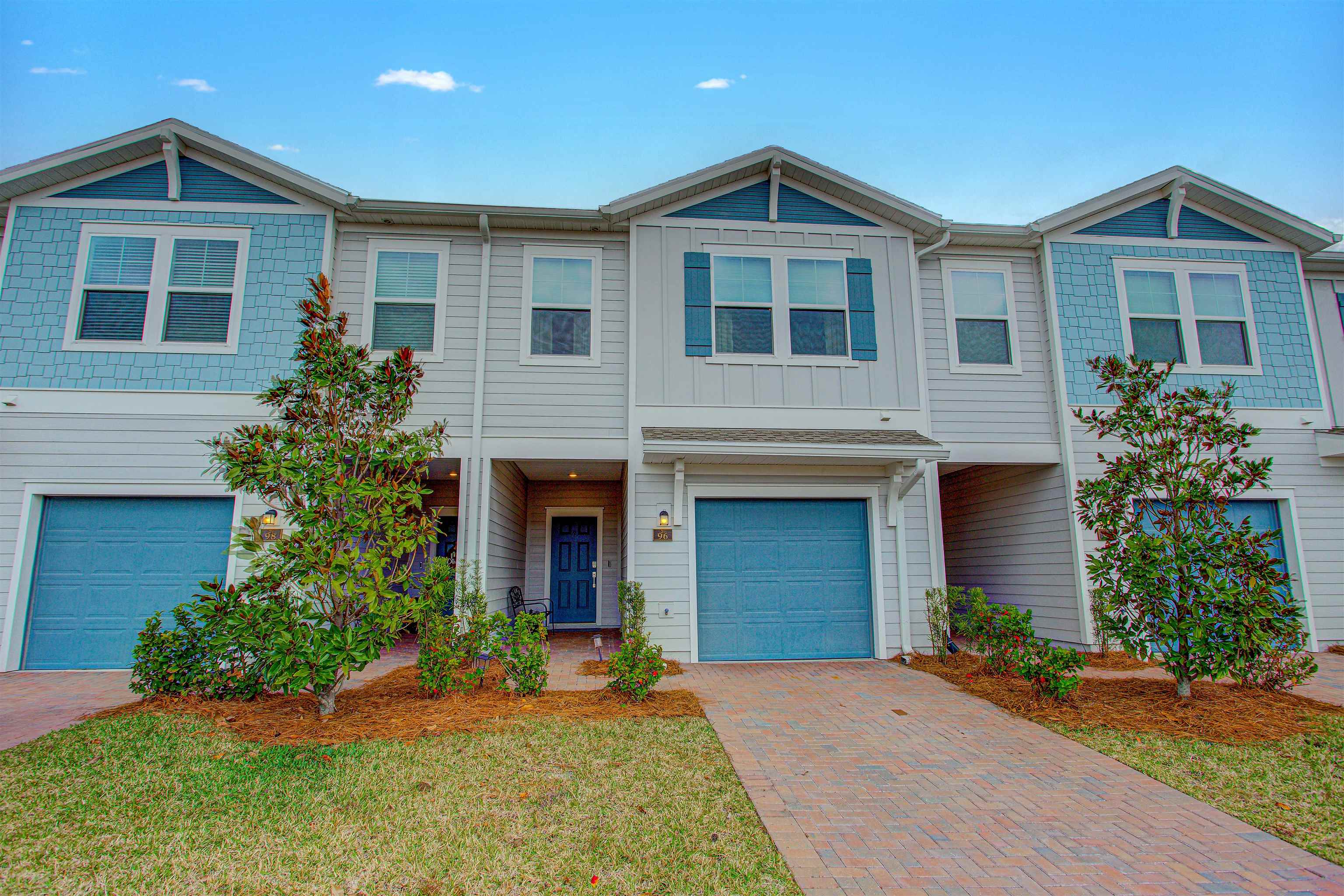 96 Bramble Court St. Augustine, FL 32092 - Photo 61 of 61 a front view of a house with a yard and garage