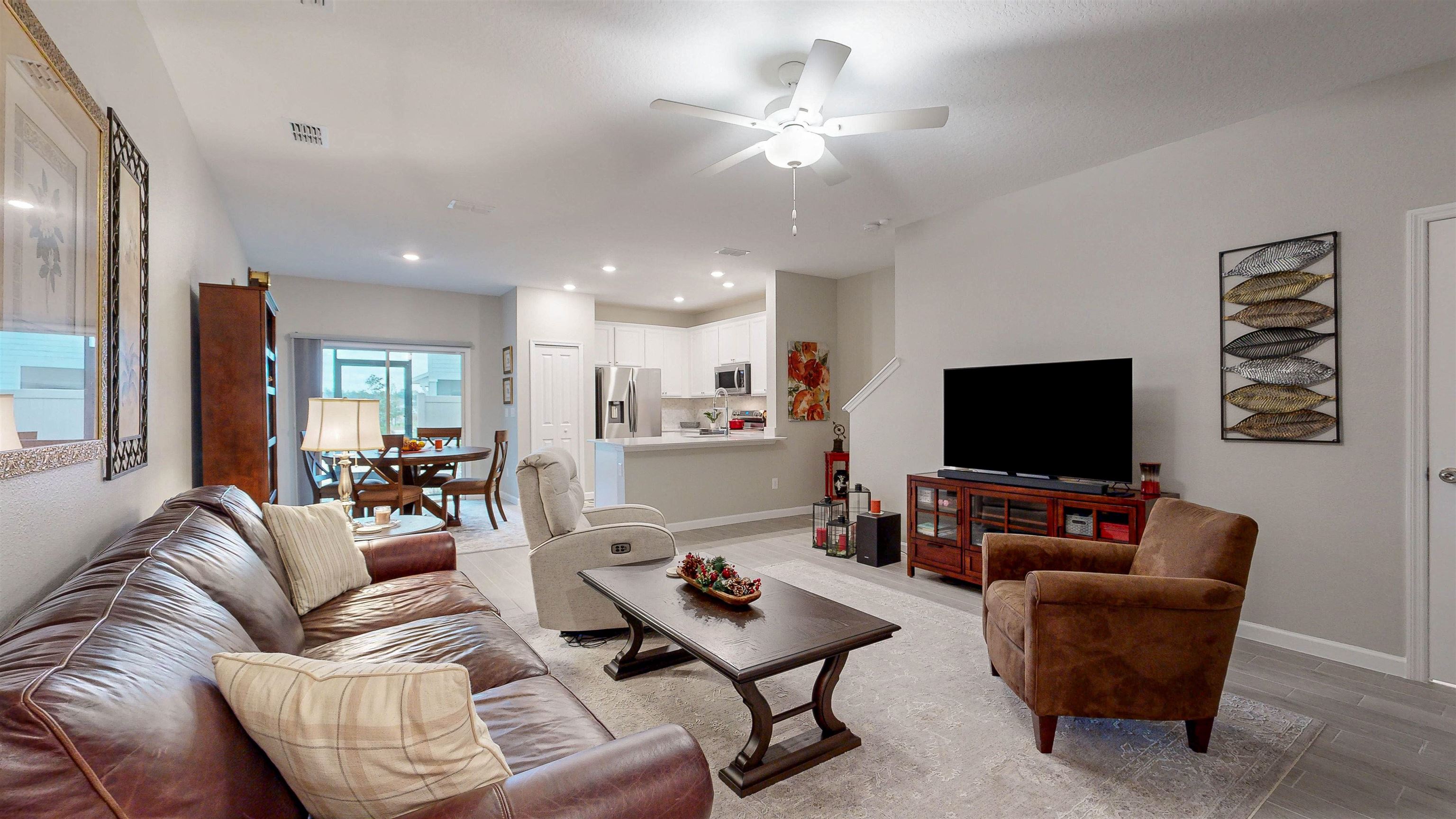 96 Bramble Court St. Augustine, FL 32092 - Photo 7 of 61 a living room with furniture and a flat screen tv