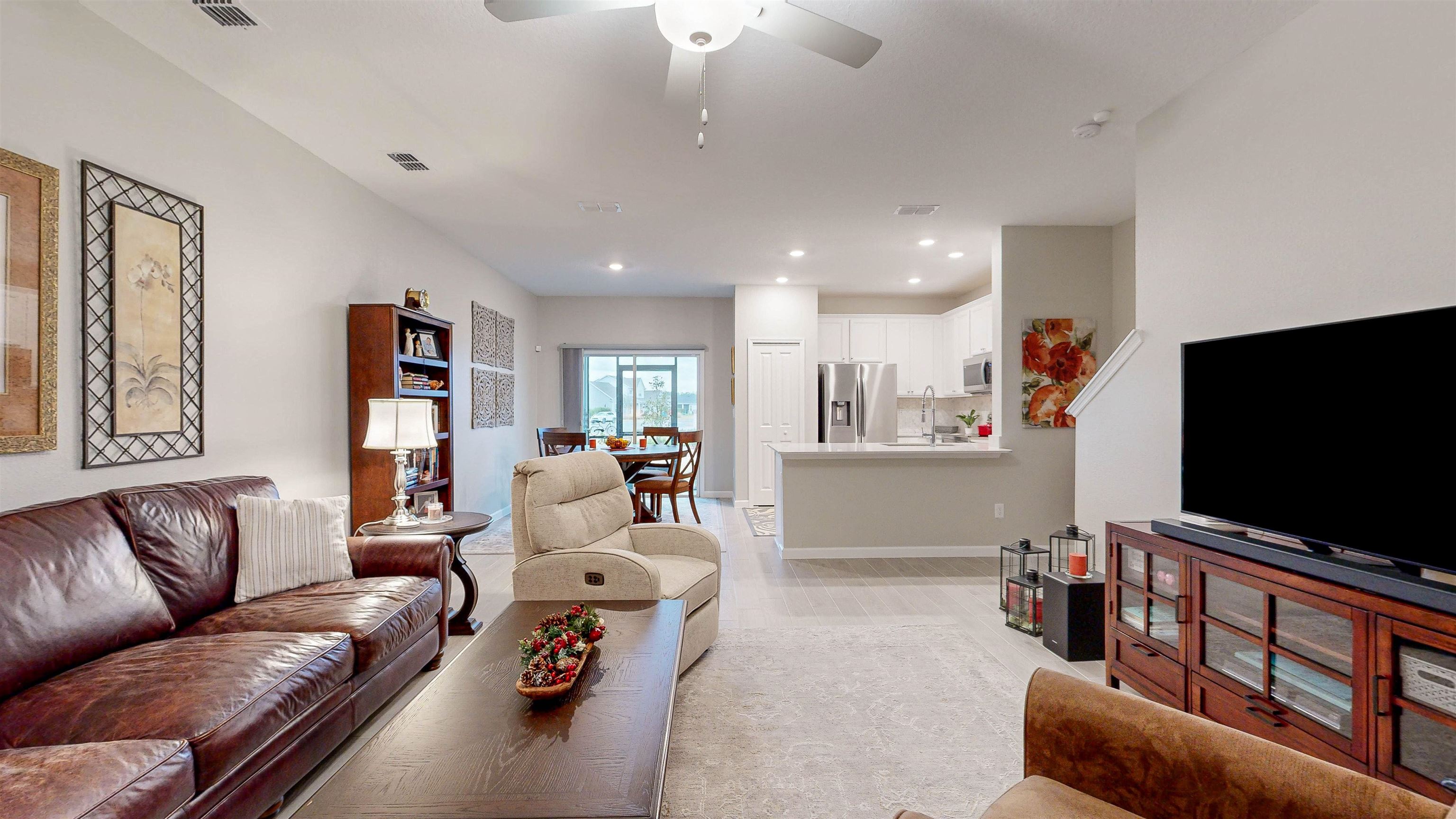96 Bramble Court St. Augustine, FL 32092 - Photo 8 of 61 a living room with furniture and a flat screen tv
