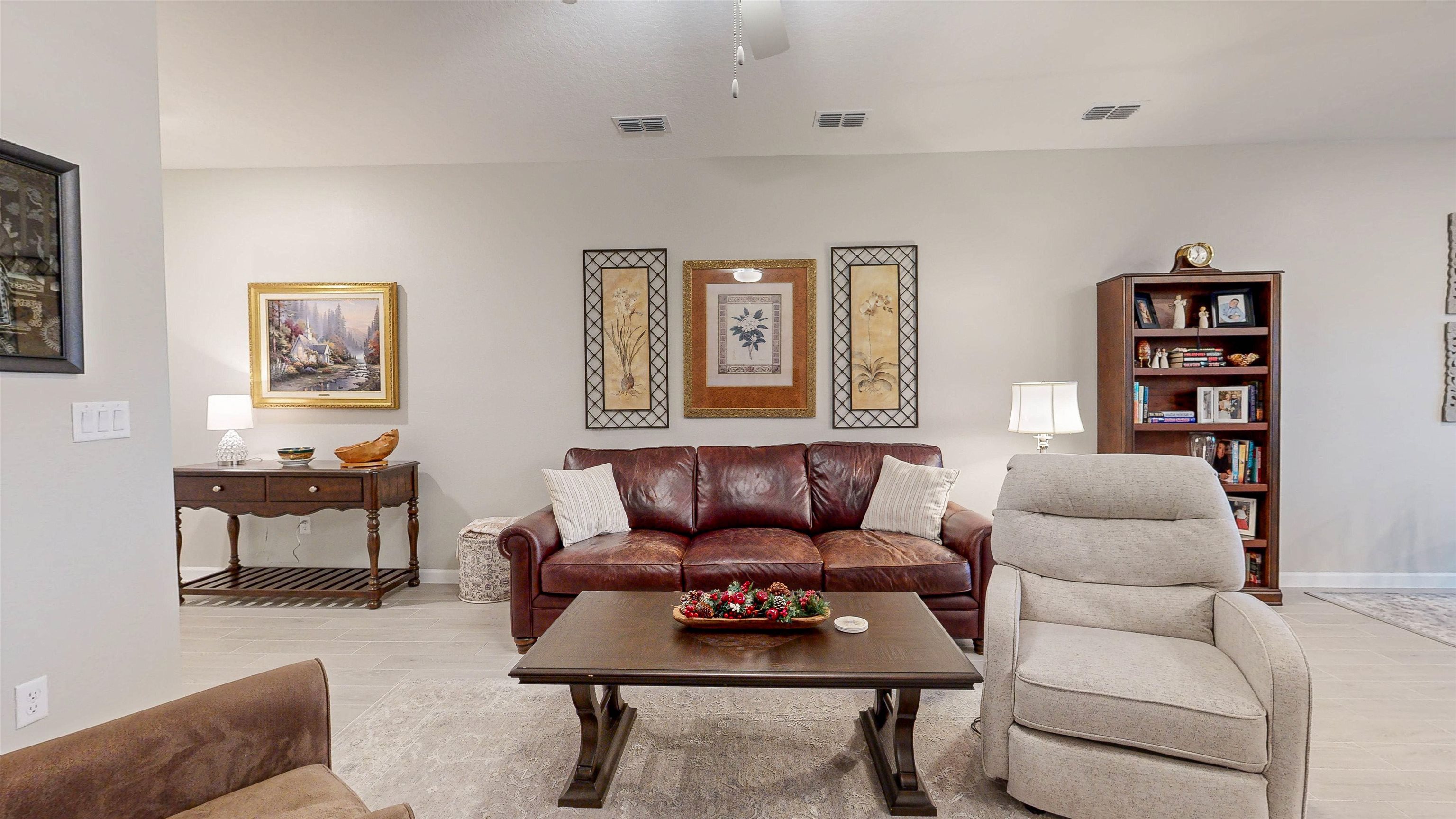 96 Bramble Court St. Augustine, FL 32092 - Photo 9 of 61 a living room with furniture a rug and a wall painting