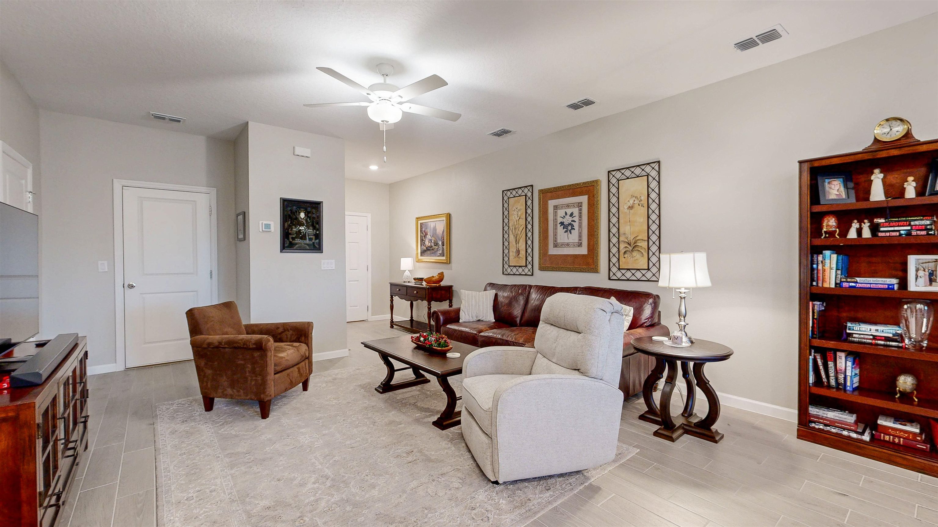 96 Bramble Court St. Augustine, FL 32092 - Photo 10 of 61 a living room with furniture and a book shelf