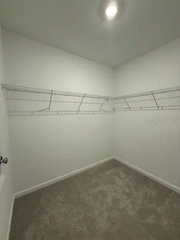 a bathroom with a double vanity sink toilet and shower