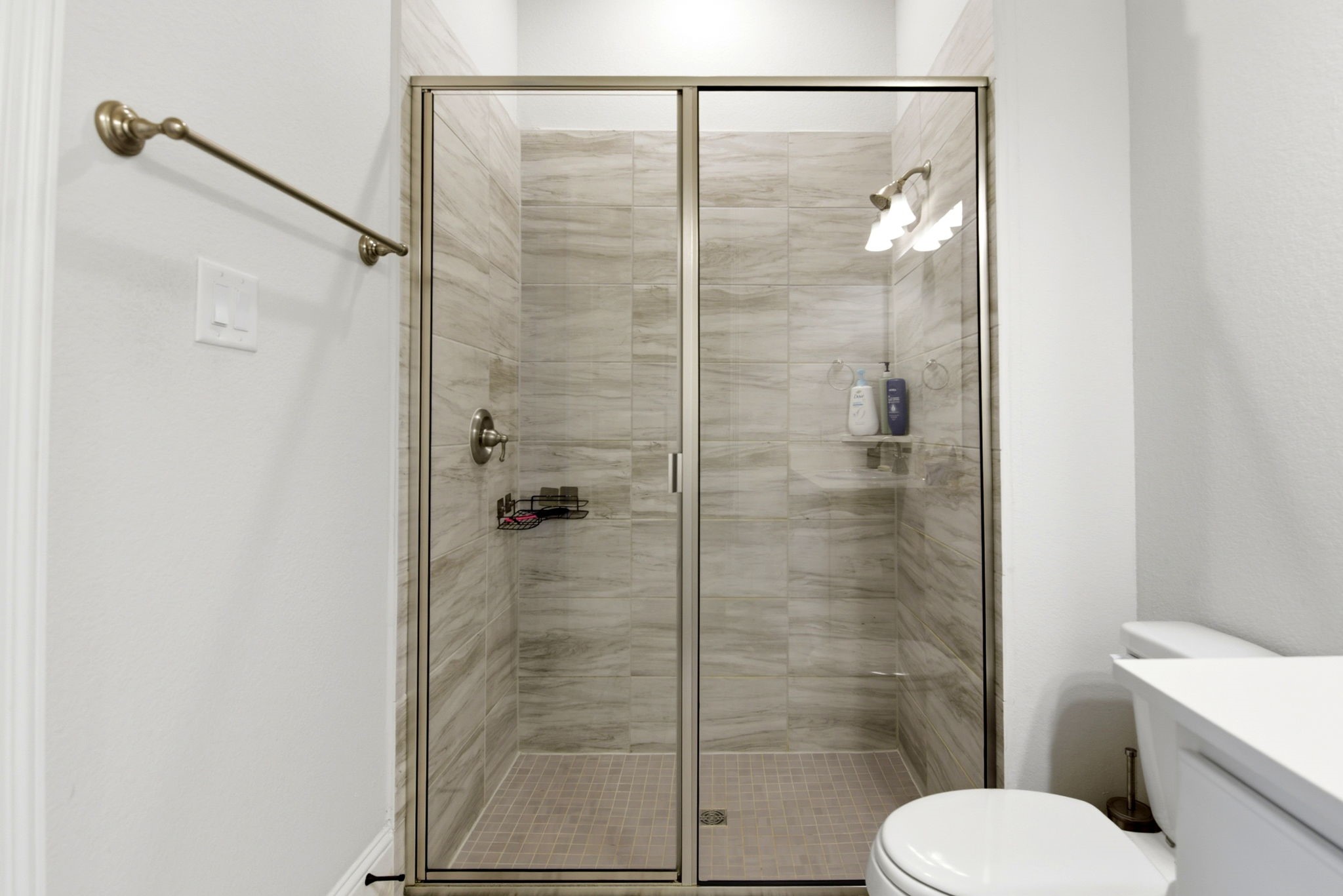 10062 South Goshawk Trail Conroe, TX 77385 - Photo 30 of 43 a bathroom with a shower and toilet