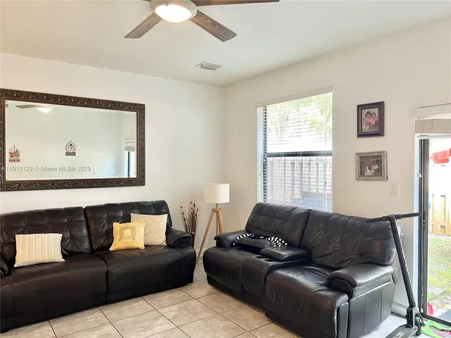 a living room with furniture and a window