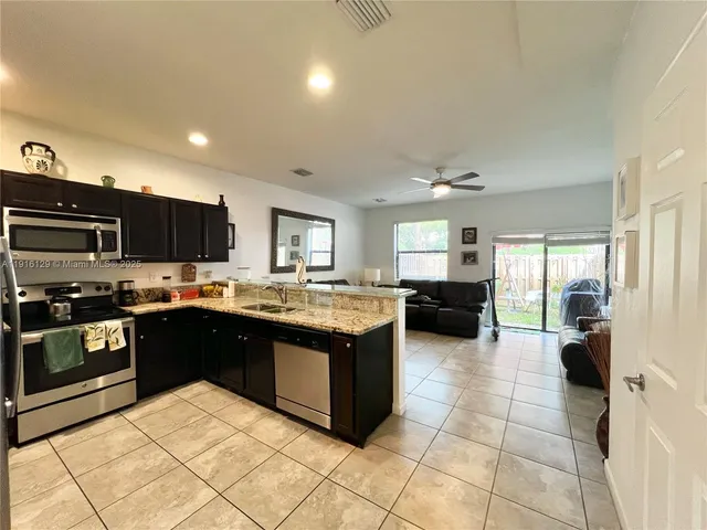 a large kitchen with lots of appliances and cabinets
